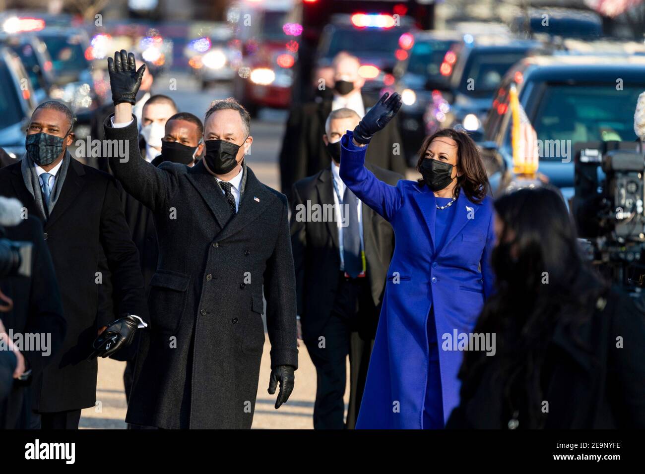 U.S Vice President Kamala Harris and Second Gentleman Doug Emhoff wave as they walk along Pennsylvania Avenue during the Inauguration Day parade January 20, 2021 in Washington, DC. Stock Photo