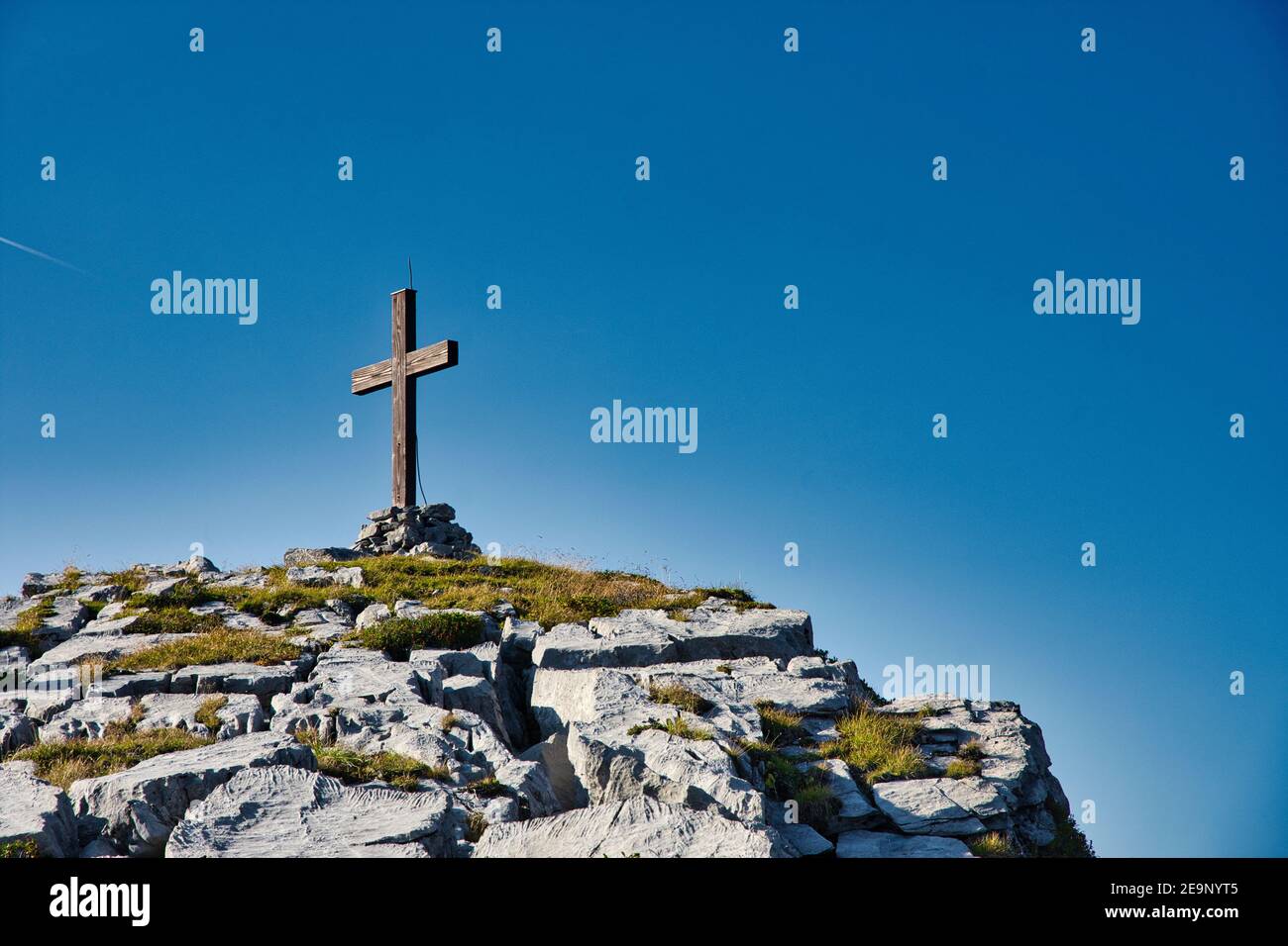 Cross on the summit of a mountain in Switzerland Stock Photo