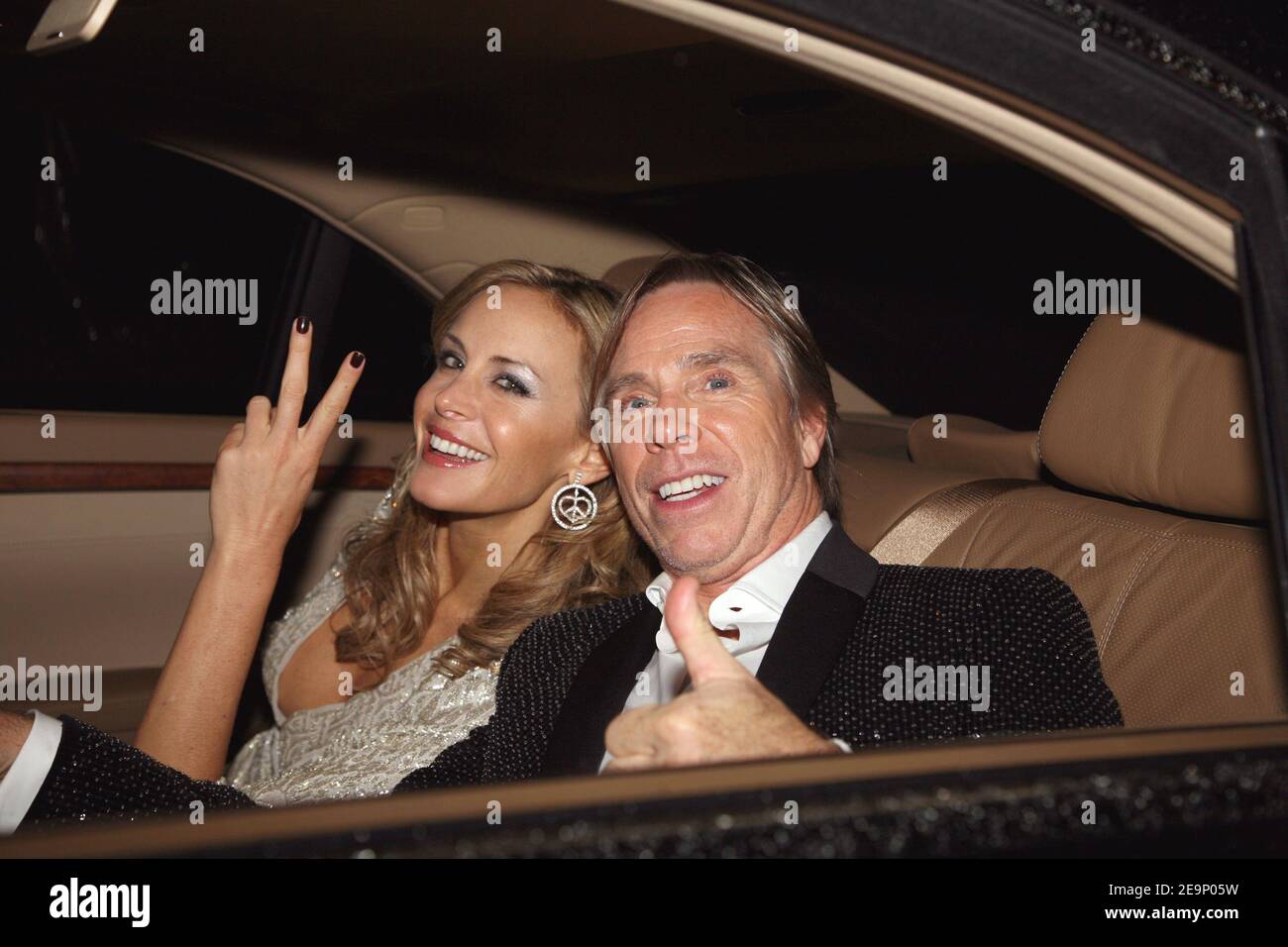US Fashion designer Tommy Hilfiger poses with his girlfriend Dee Ocleppo  arrive at the opening party for Tommy Hilfiger's flagship store in Paris,  France, on October 18, 2006. The store, located on