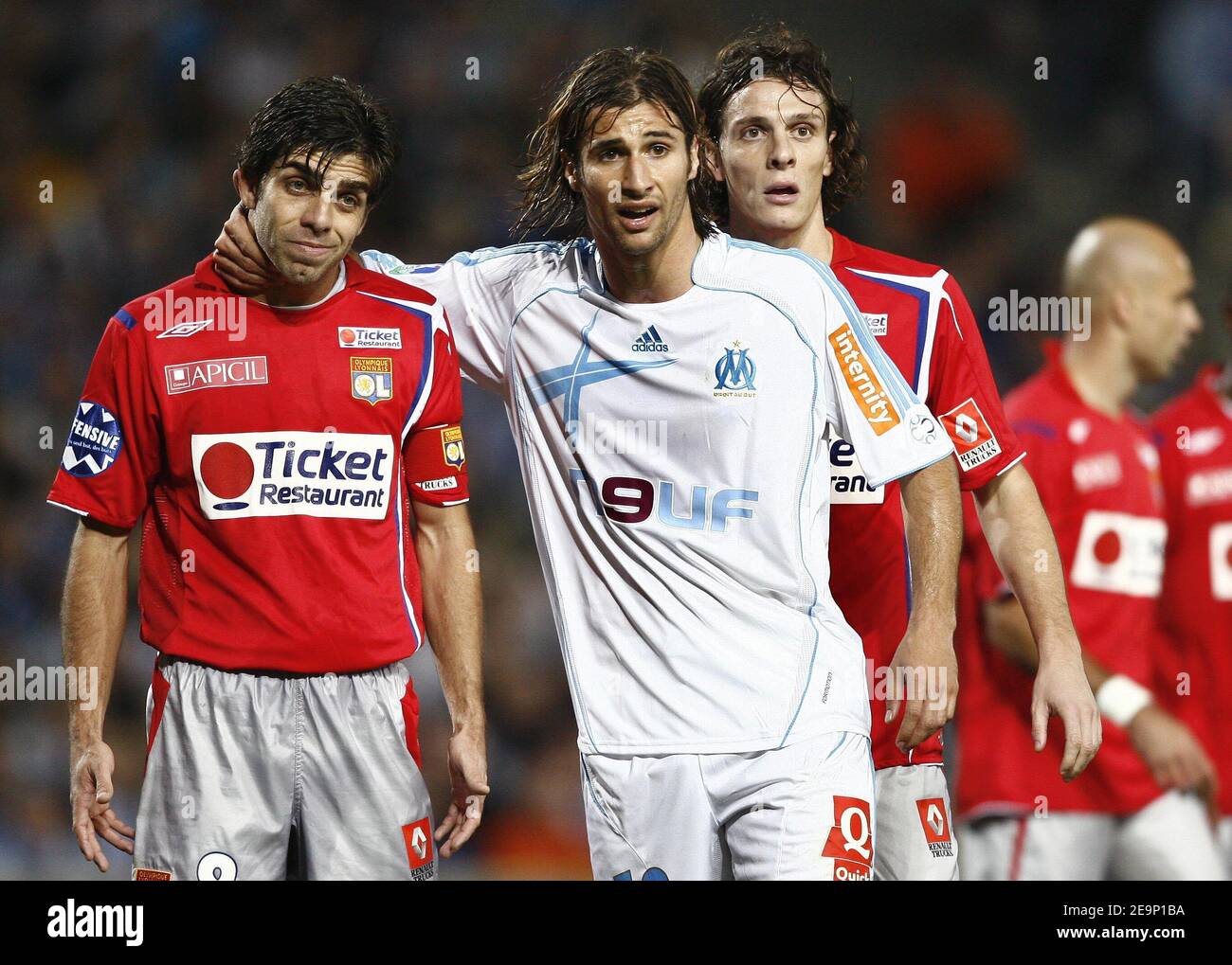 Lyon's Juninho and Marseille's Lorik Cana during the French first league football match, Olympique de Marseille vs Olympique Lyonnais, at the Velodrome stadium, in Marseille, France, on October 22, 2006. Lyon won 4-1. Photo by Christian Liewig/ABACAPRESS.COM Stock Photo