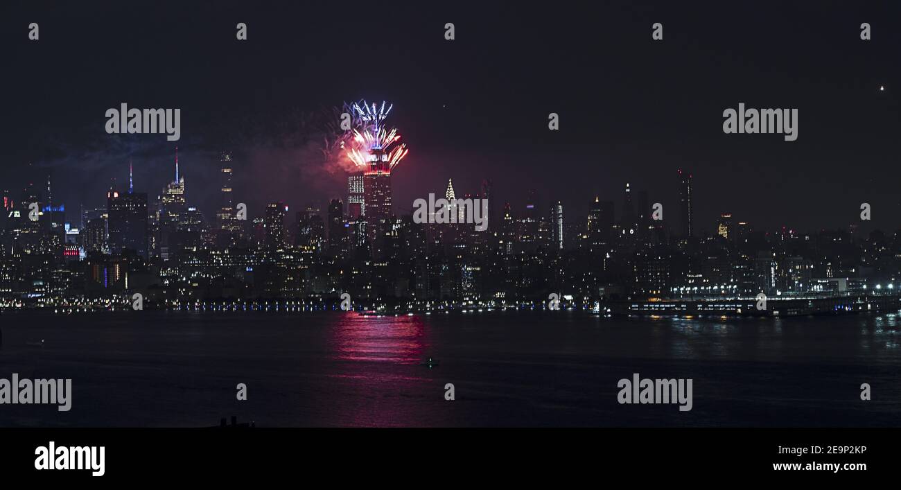 Panoramic night view of July Fourth fireworks shot from Empire State Building during 2020 coronavirus pandemic. Stock Photo