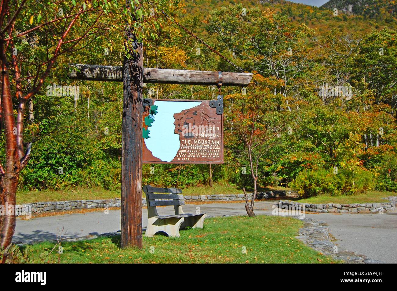 Franconia Notch with fall foliage and Old Man of the Mountain sign in Franconia Notch State Park