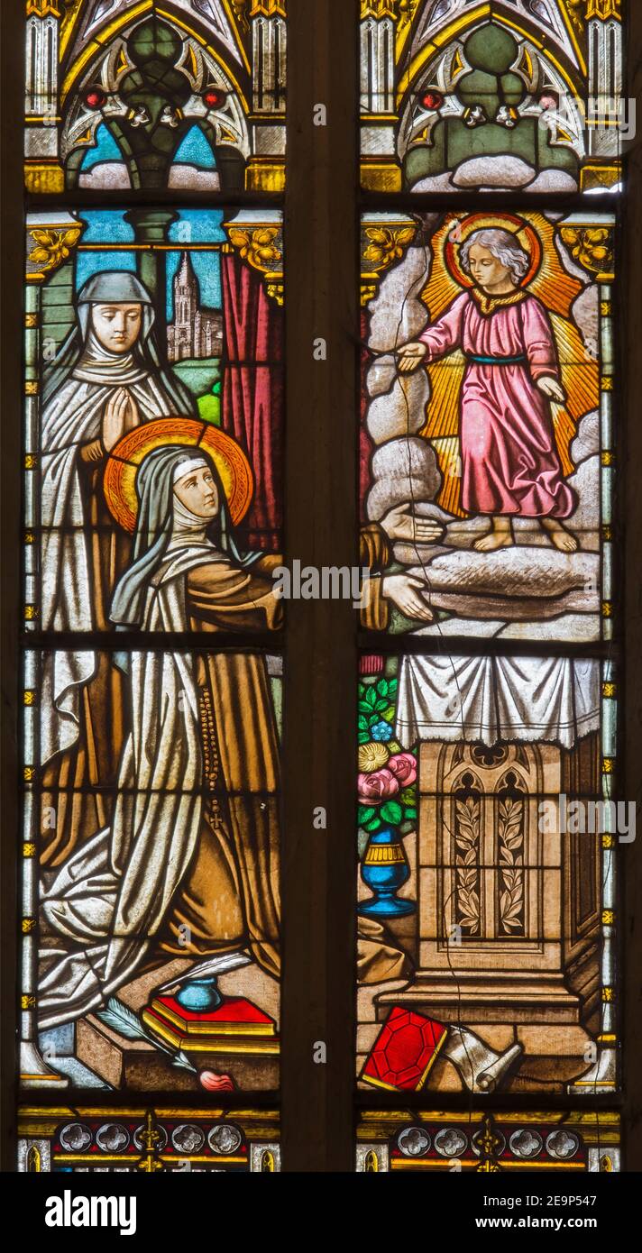 TRNAVA, SLOVAKIA - OCTOBER 14, 2014: The holy Therese on the stained glass in St. Nicholas church. Stock Photo