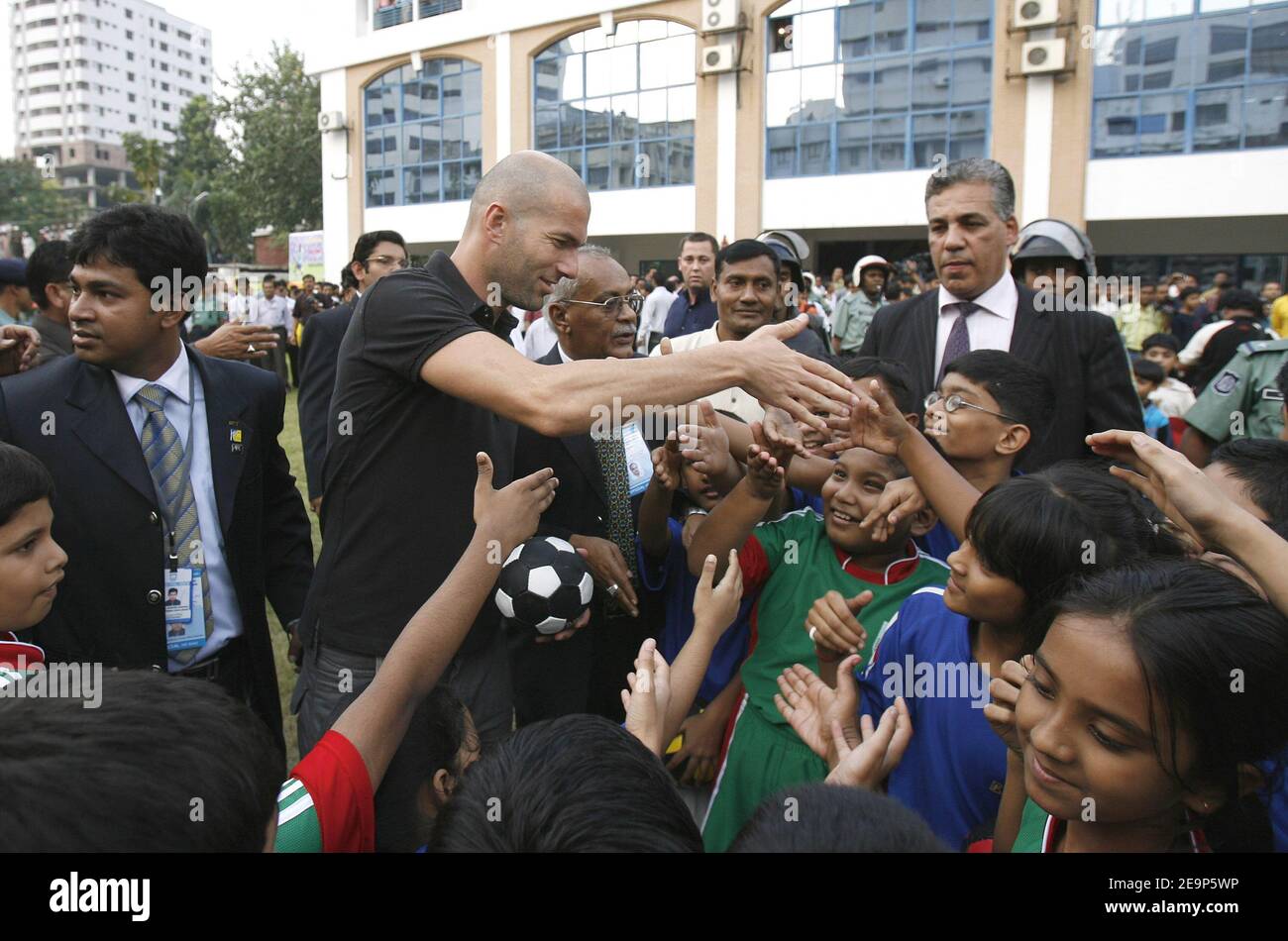 French soccer star Zinedine Zidane is surroundeed by young players at the Bangladesh football federation in Dhaka, Bangladesh on November 7, 2006. Zidane received a rousing welcome when he played football with children in a dusty Bangladeshi village. Photo by Patrick Durand/Cameleon/ABACAPRESS.COM Stock Photo
