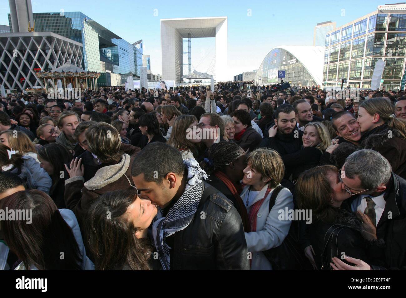 Hundreds of people kiss each other during the Operation 'Big Kiss' at La Defense near Paris in