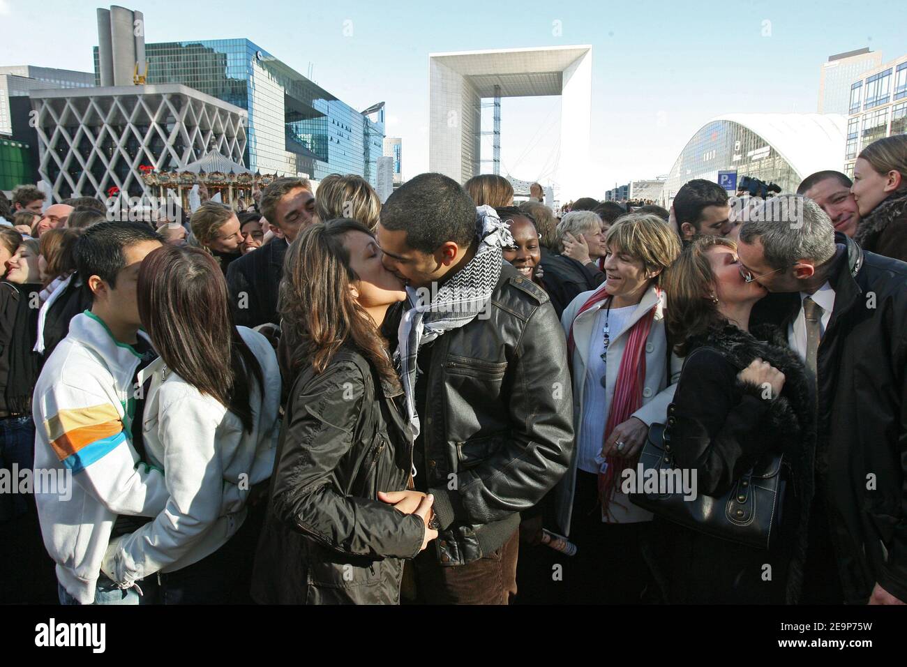 Hundreds of people kiss each other during the Operation 'Big Kiss' at La Defense near Paris in