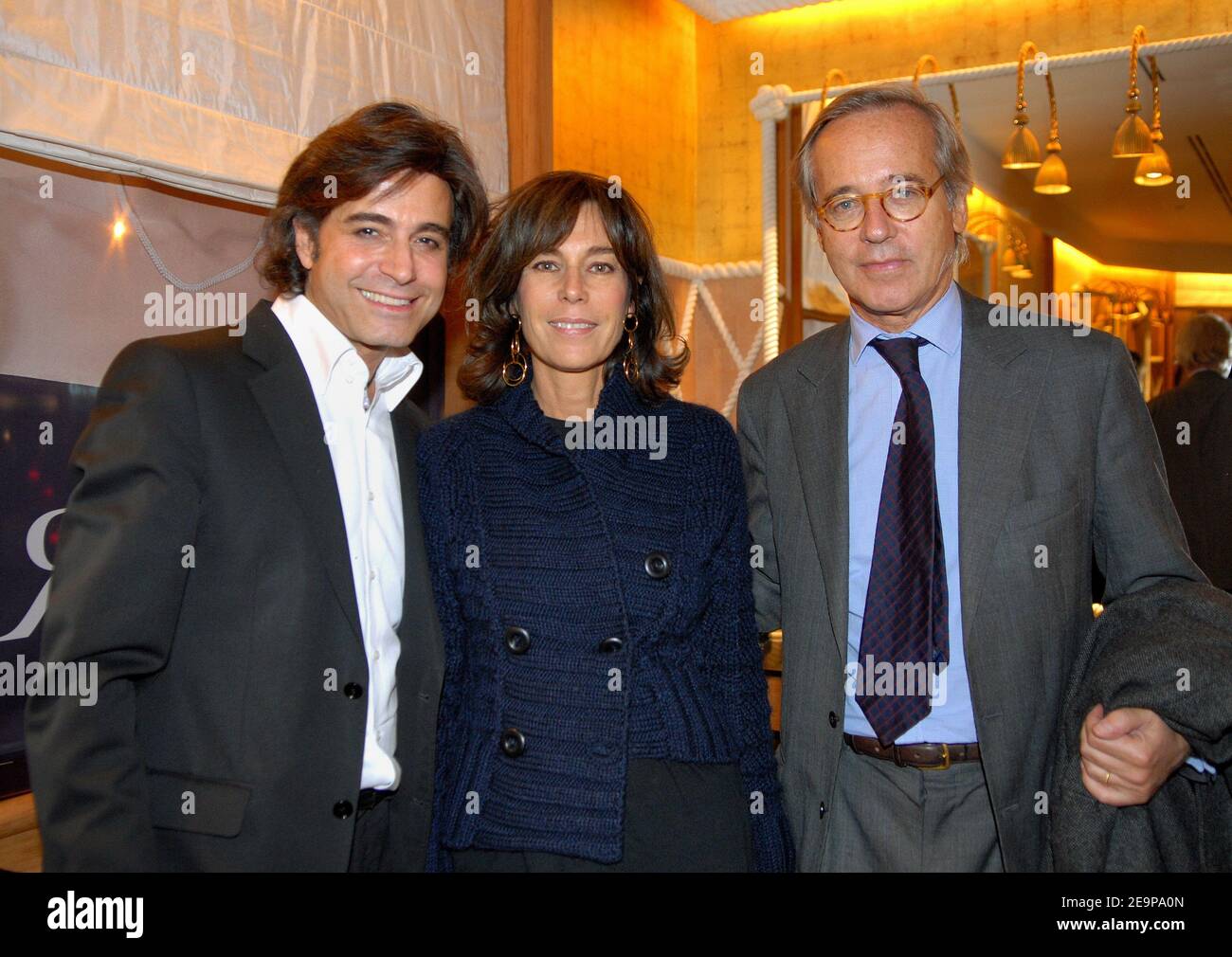 EXCLUSIVE - Star hairstylist Alexandre Zouari, French autor Christine Orban and her husband Olivier Orban attend a party for the presentation of Zouaris new book in Paris, France, on November 16, 2006. Photo by Christophe Guibbaud/ABACAPRESS.COM Stock Photo