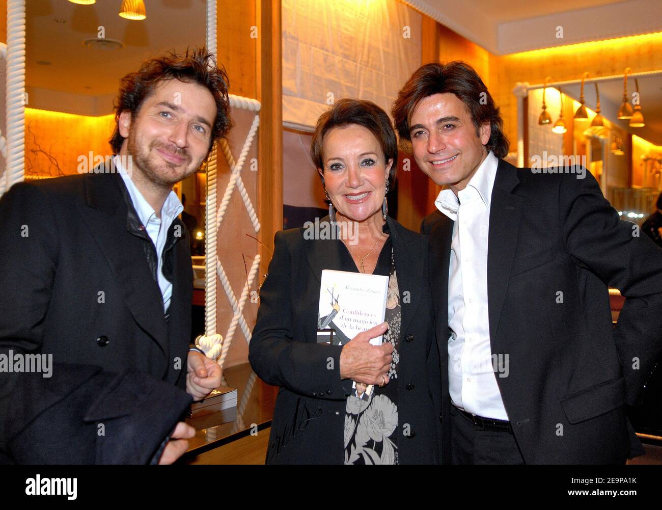 EXCLUSIVE - French actor Edouard Baer, clairvoyant Yaguel Didier and Star hairstylist Alexandre Zouari attend a party for the presentation of Zouaris new book in Paris, France, on November 16, 2006. Photo by Christophe Guibbaud/ABACAPRESS.COM Stock Photo
