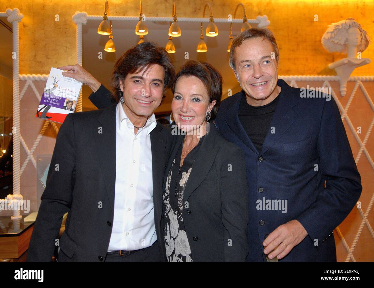 EXCLUSIVE - Star hairstylist Alexandre Zouari, clairvoyant Yaguel Didier and her husband Patrick attend a party for the presentation of Zouaris new book in Paris, France, on November 16, 2006. Photo by Christophe Guibbaud/ABACAPRESS.COM Stock Photo