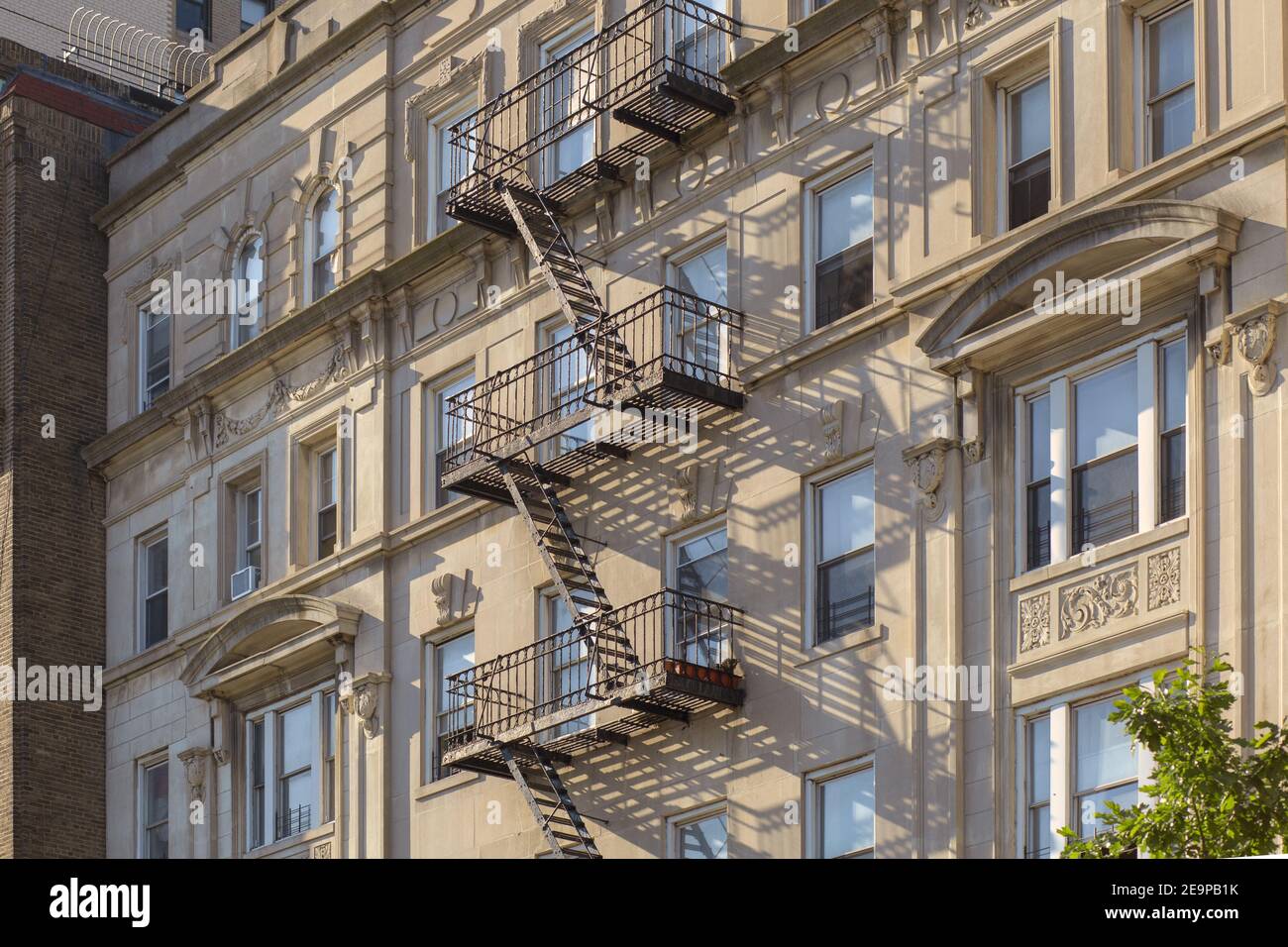 Exterior fire escape stairs on the stone building wall Stock Photo Alamy