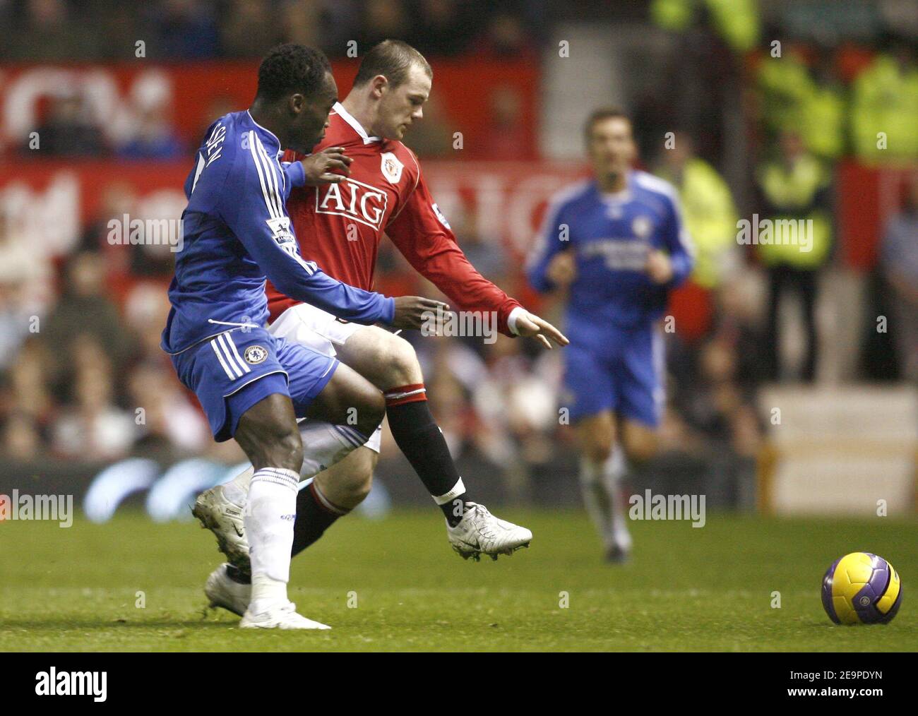 Chelsea's Michael Essien and Manchester United's Wayne Rooney battle for the ball during the FA Barclays Premiership, Manchester United vs Chelsea at the Old Trafford stadium in Manchester,UK on November 26, 2006. The match ended in a 1-1 draw. Photo by Christian Liewig/ABACAPRESS.COM Stock Photo