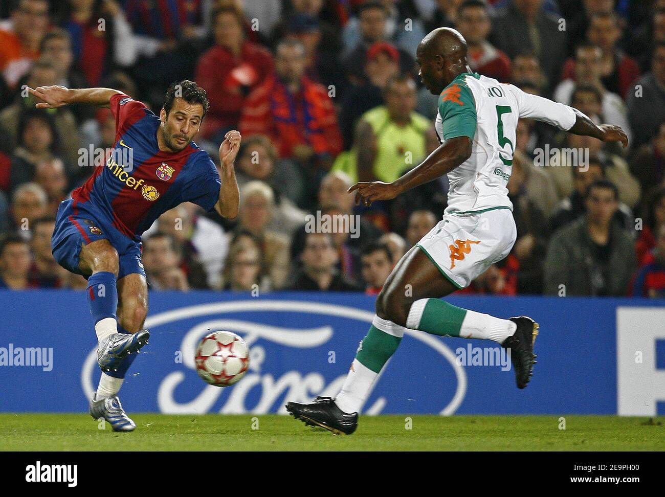 Barcelona's Ludovic Giuly and Werder Bremen's Pierre Wome battle for the  ball during the UEFA Champions League, Group A, FC Barcelona vs Werder  Bremen at Camp Nou, in Barcelona, Spain, on December