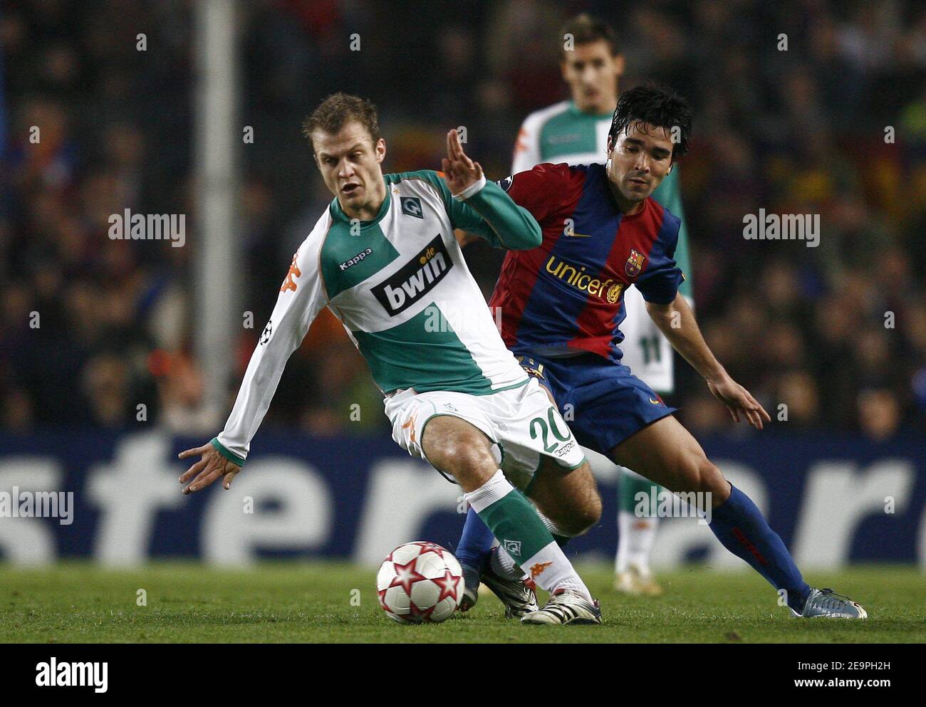 Barcelona's Deco and Werder Bremen's Daniel Jensen battle for the ball  during the UEFA Champions League, Group A, FC Barcelona vs Werder Bremen at  Camp Nou, in Barcelona, Spain, on December 5,