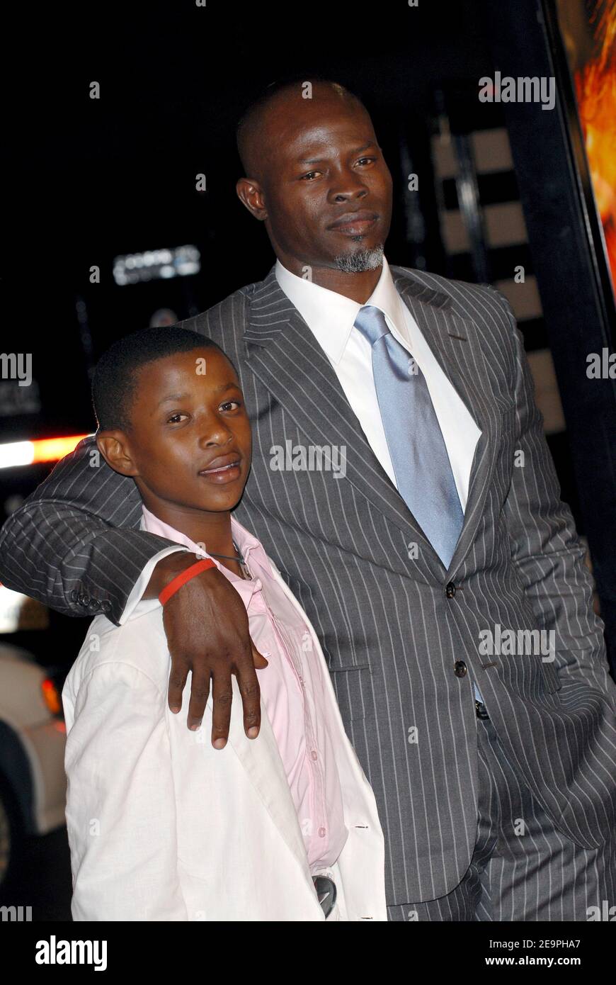 Djimon Hounsou and Kagiso Kuypers attend Warner Brothers Pictures