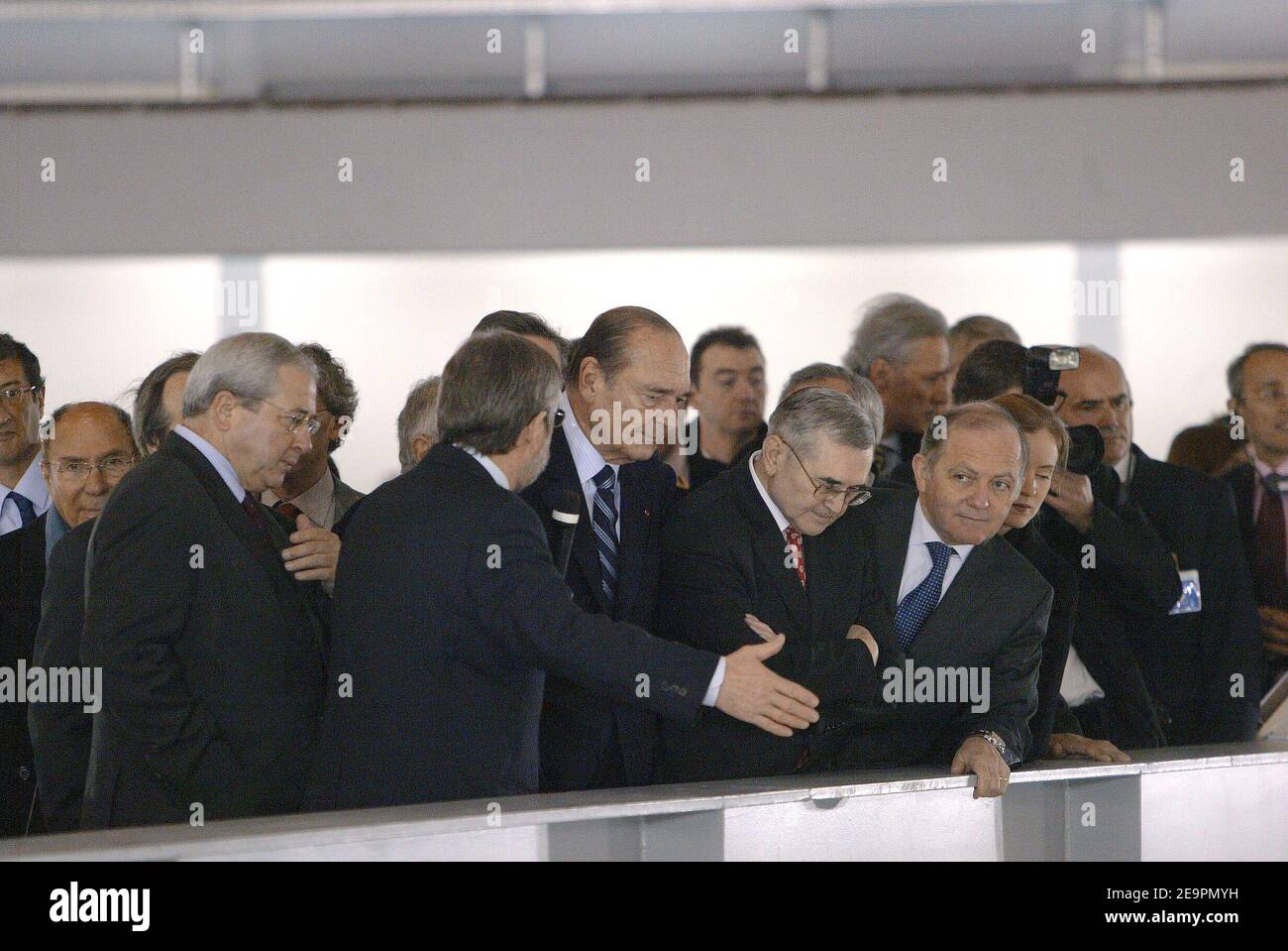 French President Jacques Chirac flanked by Jean-Marc Filhol and Jean-Paul  Huchon, inaugurates the 'Synchrotron Soleil' site, in Saint-Aubin, near  Paris, on December 18, 2006. A synchrotron is an electron accelerator meant  to