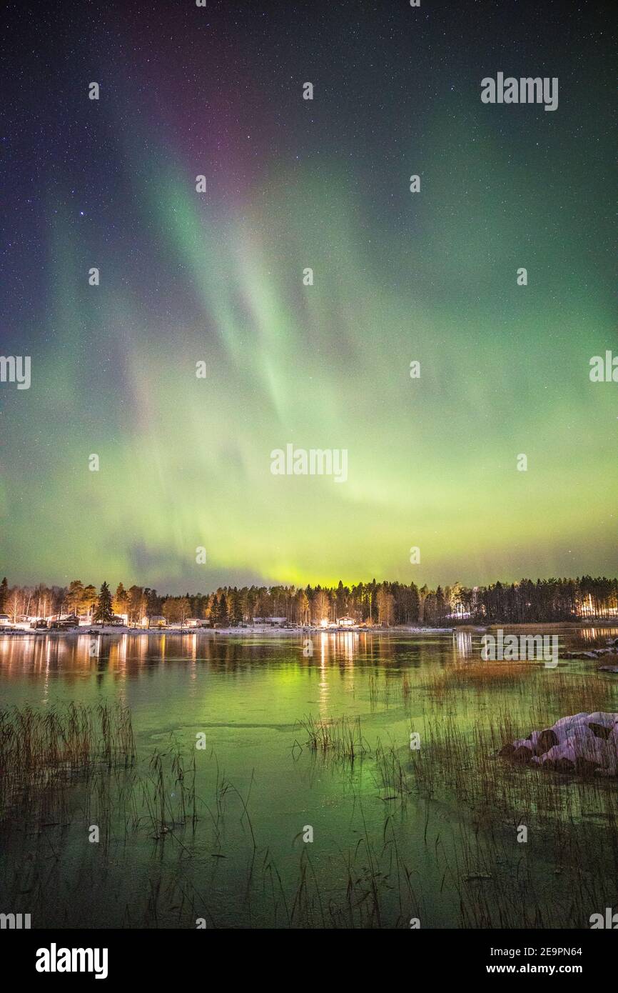 Northern Lights Over Snowy and frozen lake Stock Photo - Alamy