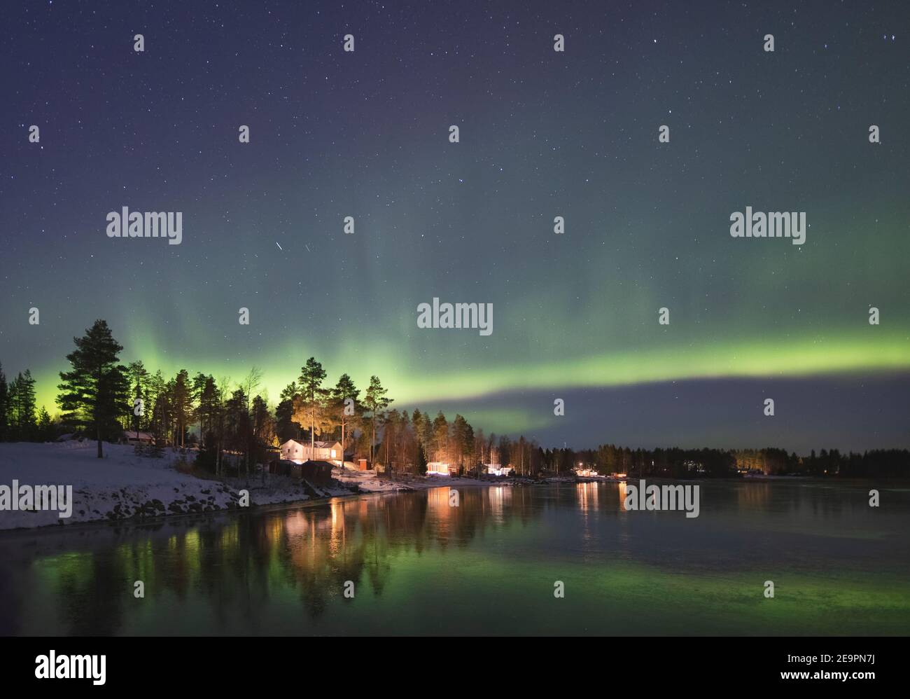 northern lights over frozen and snowy lake Stock Photo - Alamy