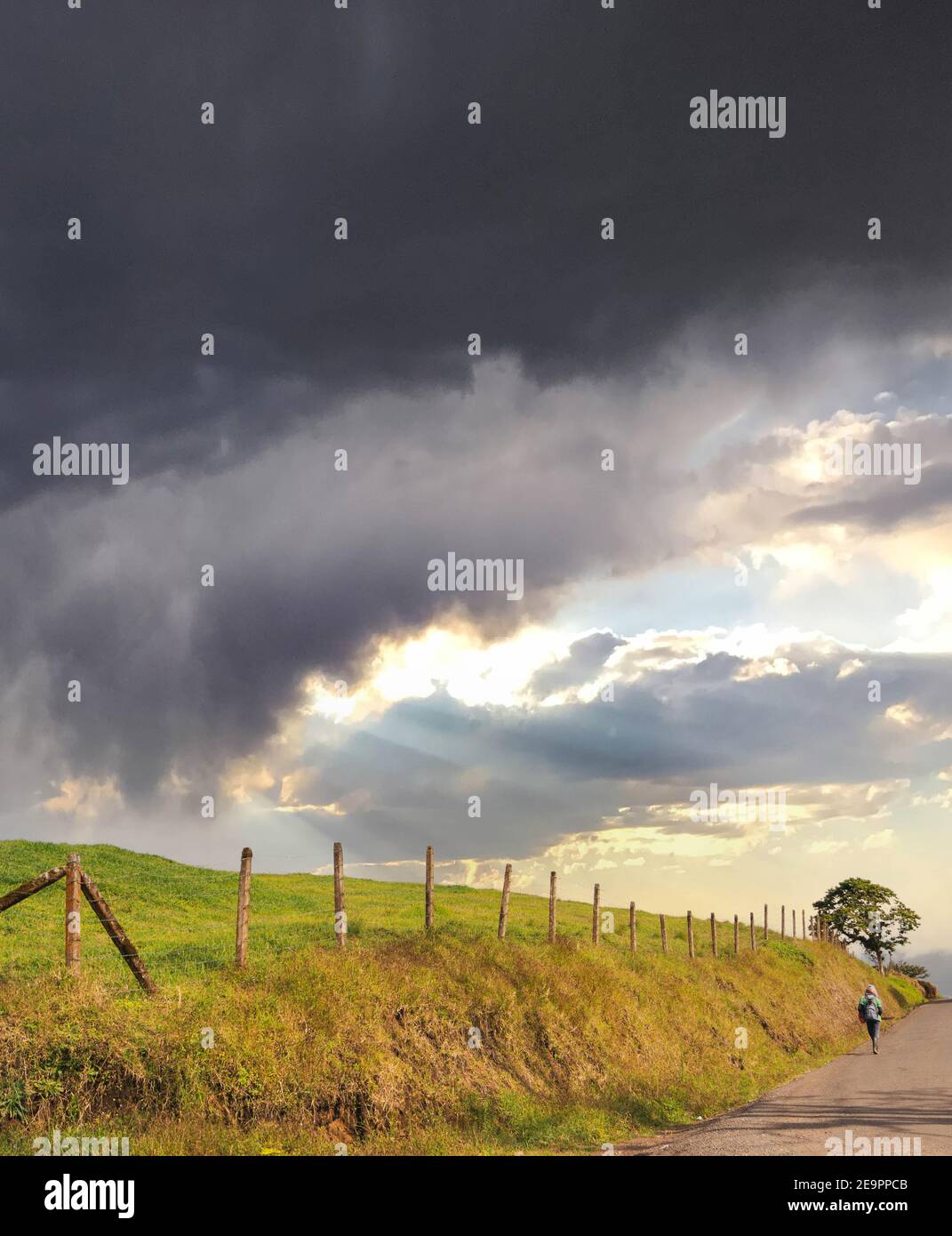 Boy walking country road alone hi-res stock photography and images - Alamy