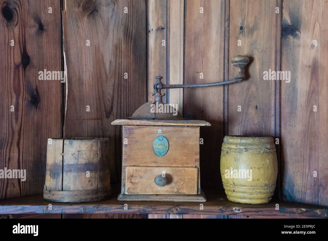 Old coffee grinder on a shelf with storage boxes Stock Photo Alamy
