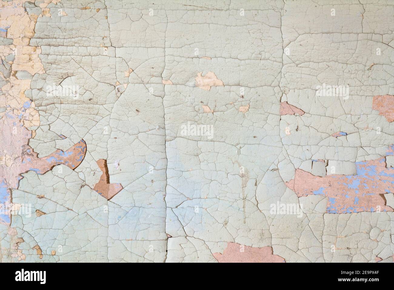 old plaster wall background and texture with holes and cracks and paint