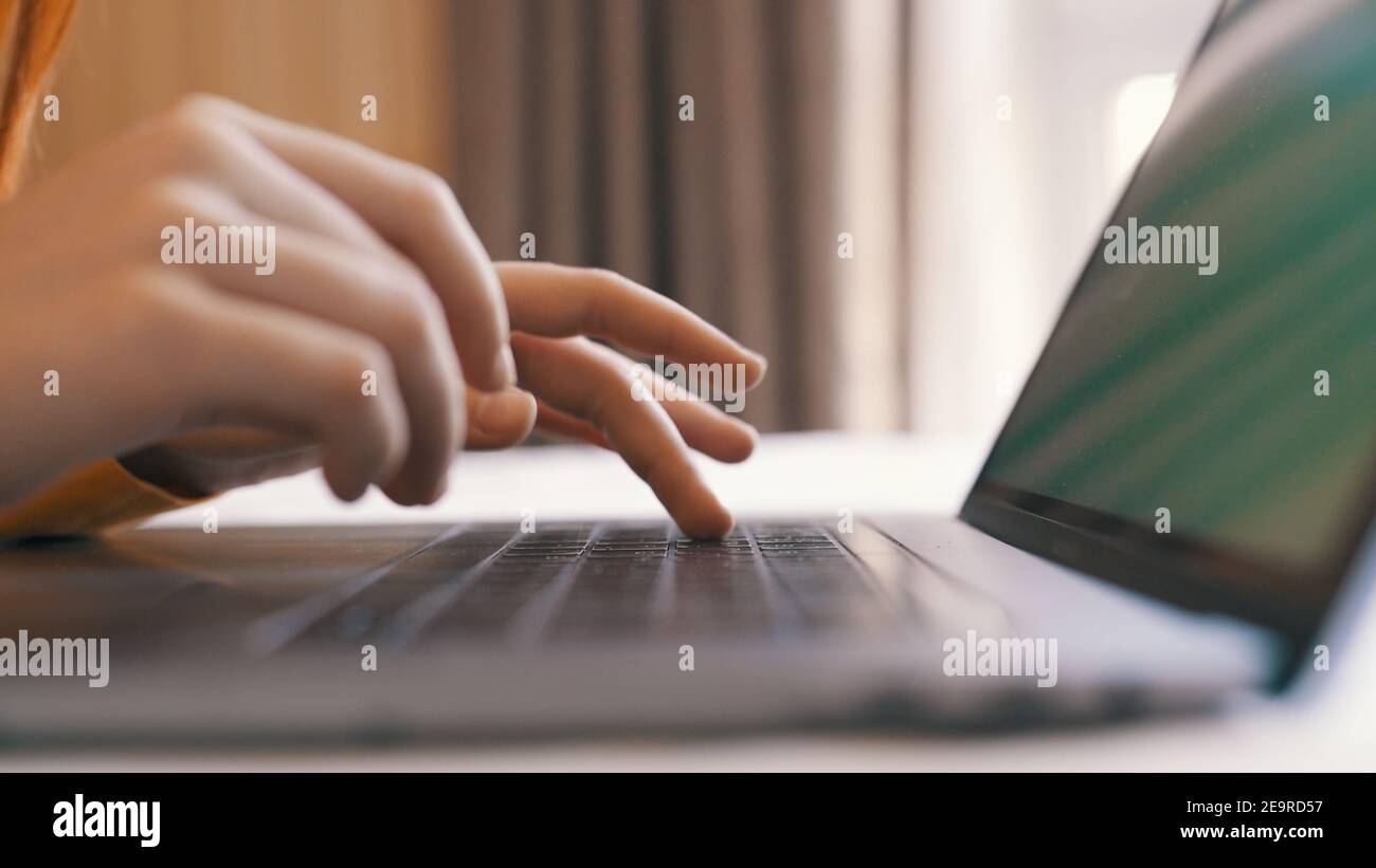 typing on laptop keyboard internet close-up work communication Stock