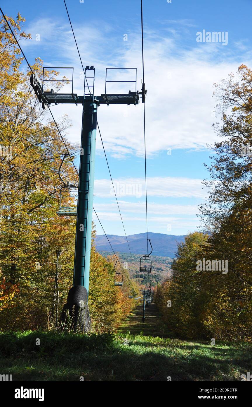 Vermont Fall Foliage and ski lift in forest on Mount Mansfield in Vermont, USA. Stock Photo