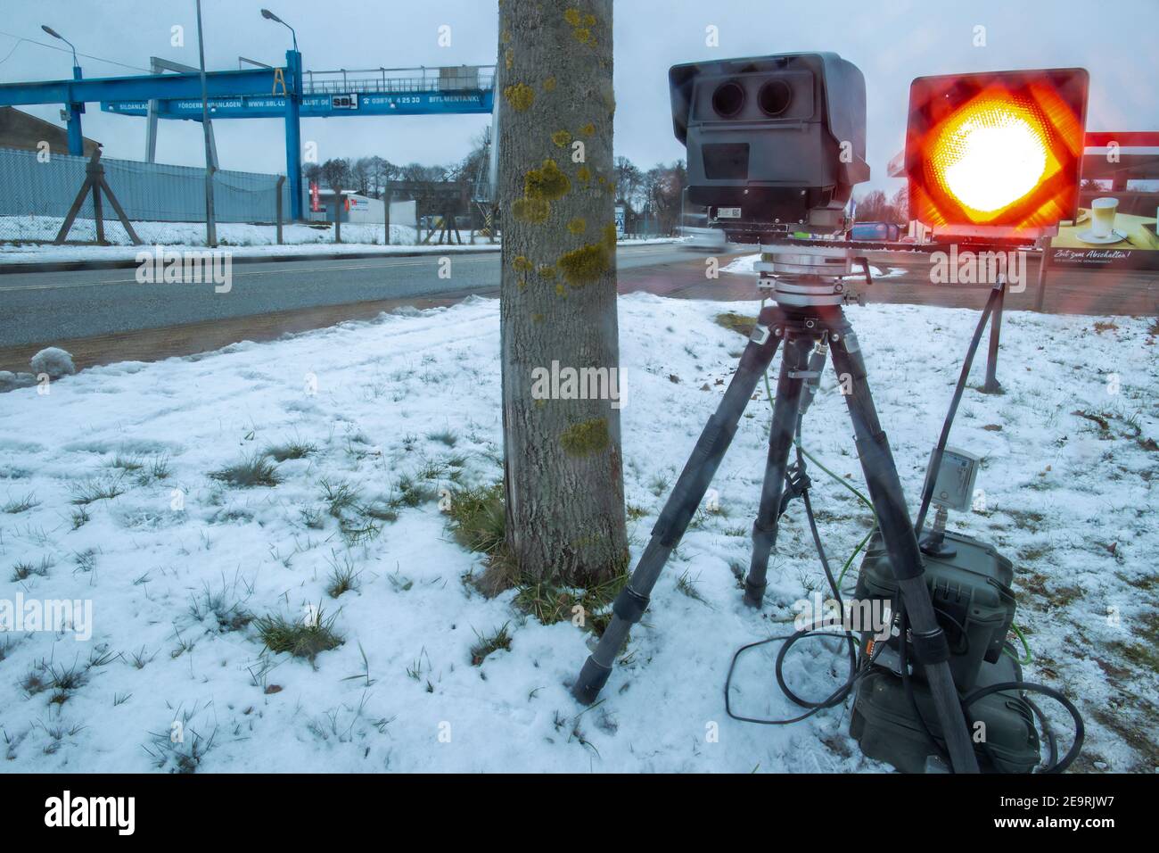 Ludwigslust, Germany. 05th Feb, 2021. The red flash of a mobile speed  measurement of the traffic monitoring of the district Ludwigslust-Parchim  triggers during a control in a locality. The counties and independent