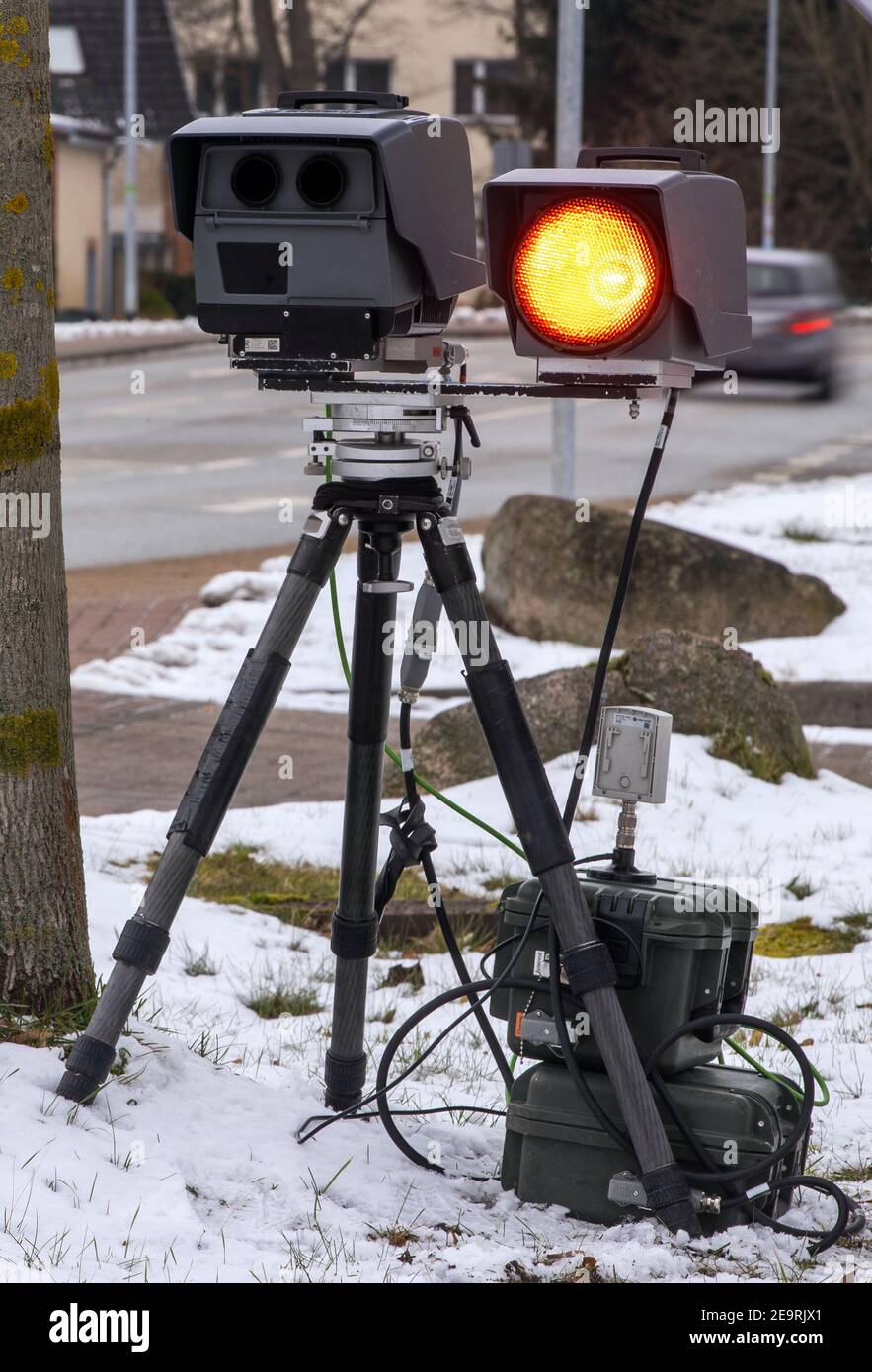 Ludwigslust, Germany. 05th Feb, 2021. The red flash of a mobile speed  measurement of the traffic monitoring of the district Ludwigslust-Parchim  triggers during a control in a locality. The counties and independent