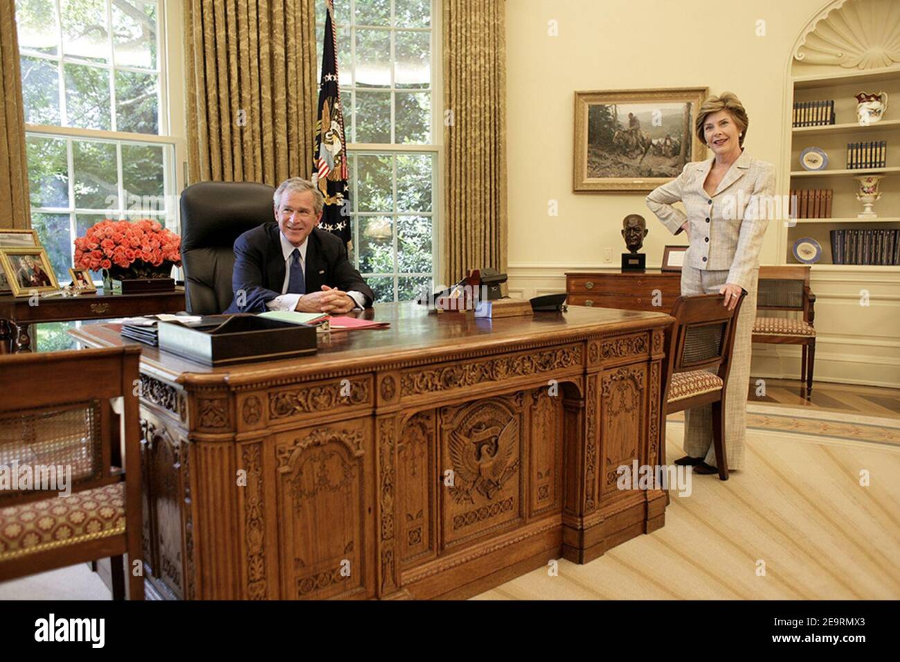 Mrs. Laura Bush and President W. Bush in the Oval Office Stock
