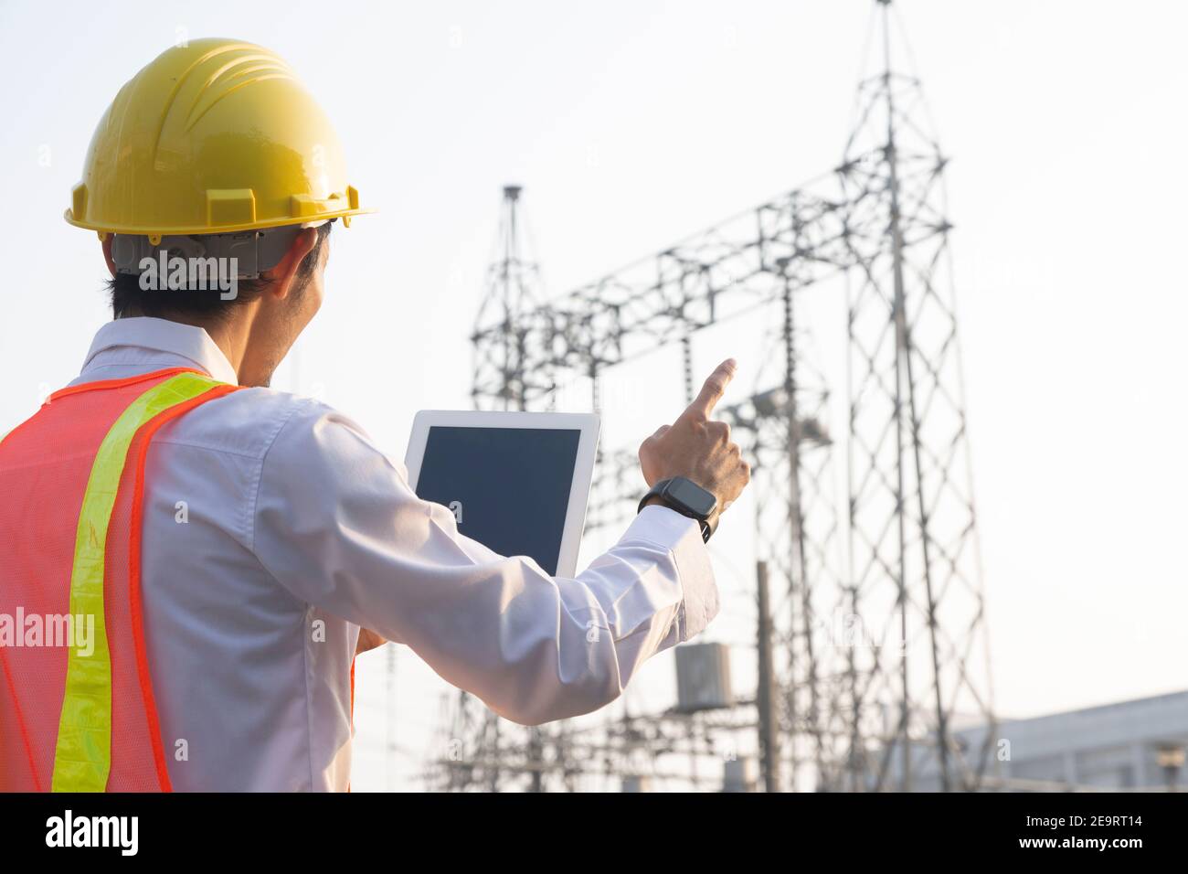 Engineer Tablet Engineer use tablet technology at power plant system Stock Photo - Alamy