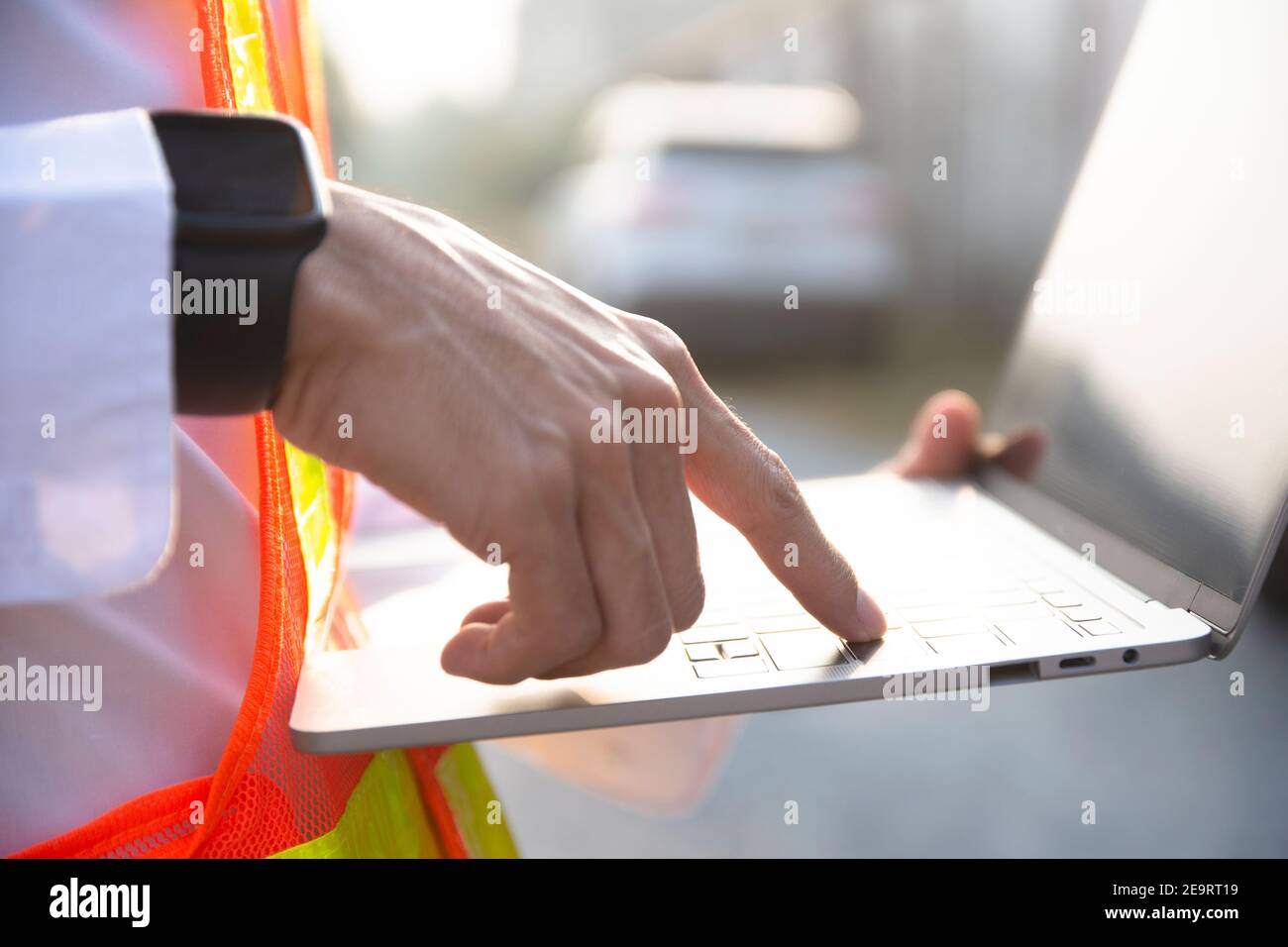 Engineer hold laptop computer inspection on site power plant high volte system Stock Photo