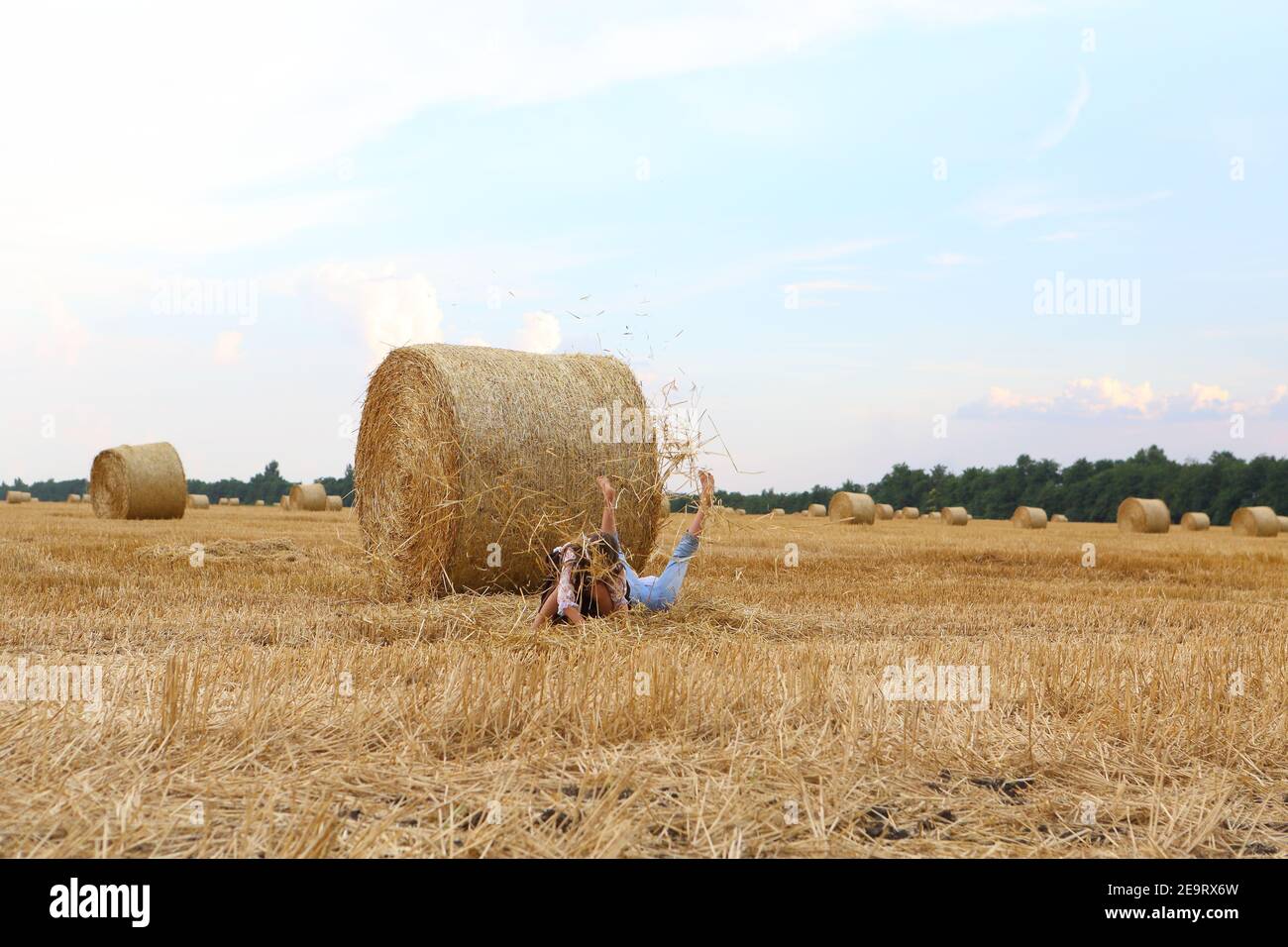 Two little girls playing in a wheat field Stock Photo - Alamy