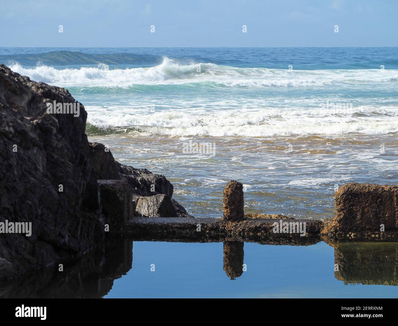 Looking out across Sawtell Wave Pool to breaking waves in the Pacific ...