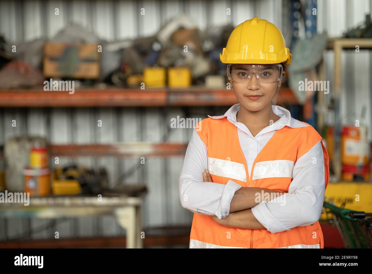 Portrait of smart women worker Asian race with protective safety suit standing smile Stock Photo