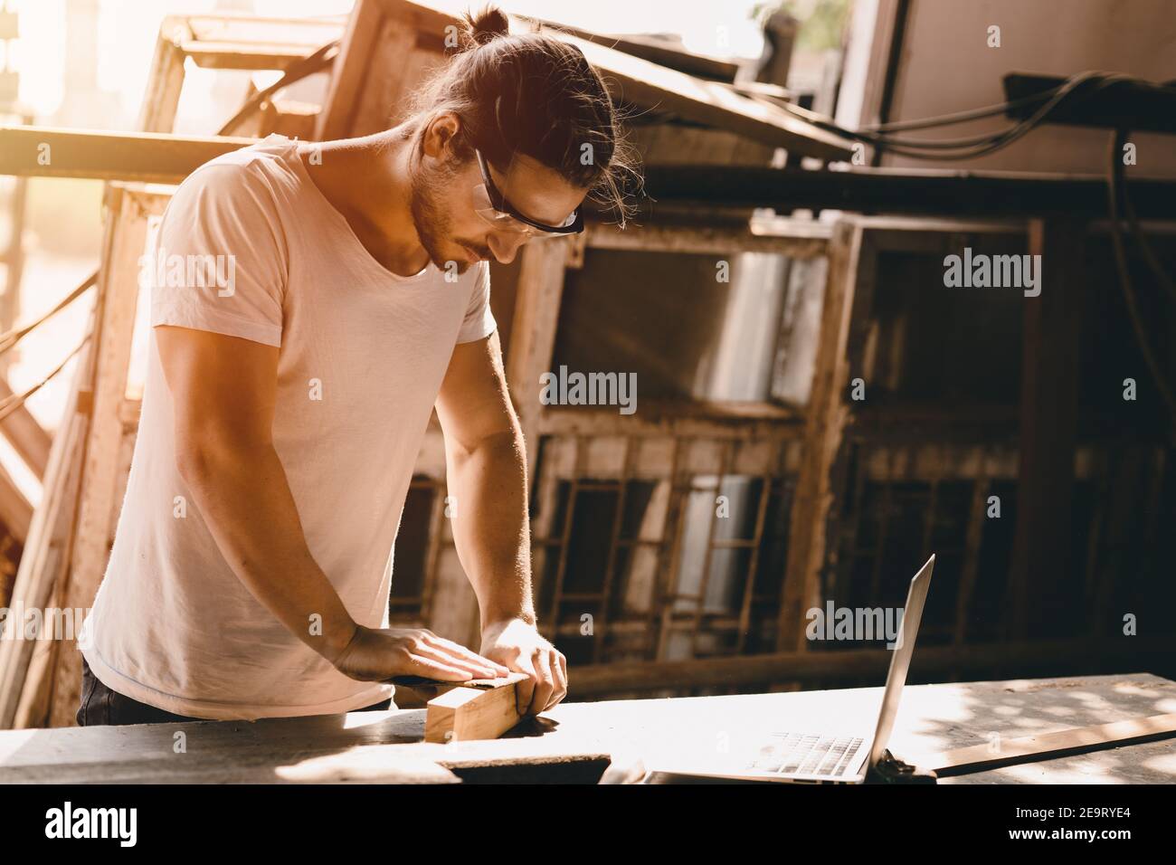 Carpenter man woodcraft working in furniture wood workshop with professional skill real people workman. Stock Photo