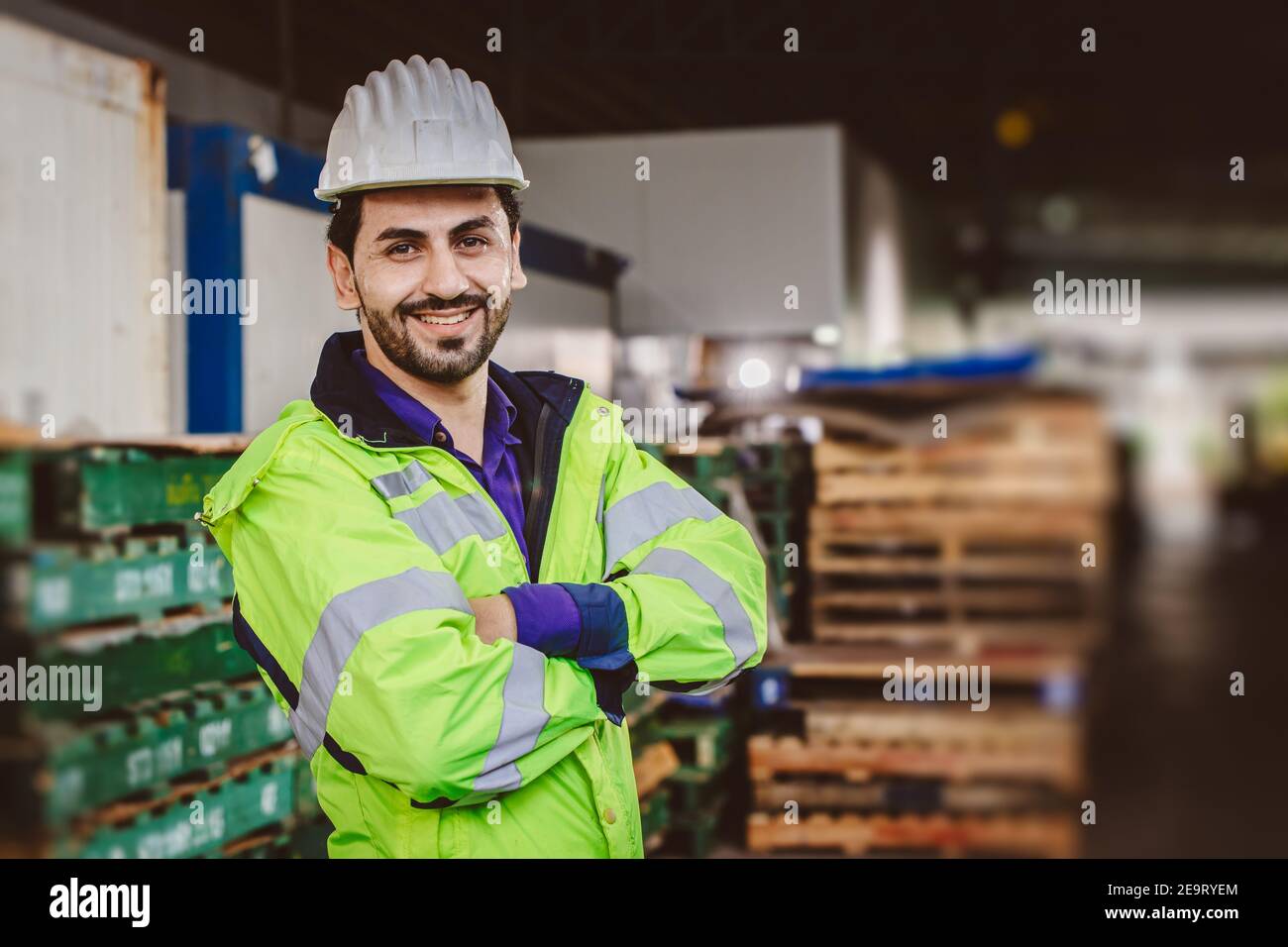 Smart Hispanic latin engineer worker working in logistic port cargo Stock Photo