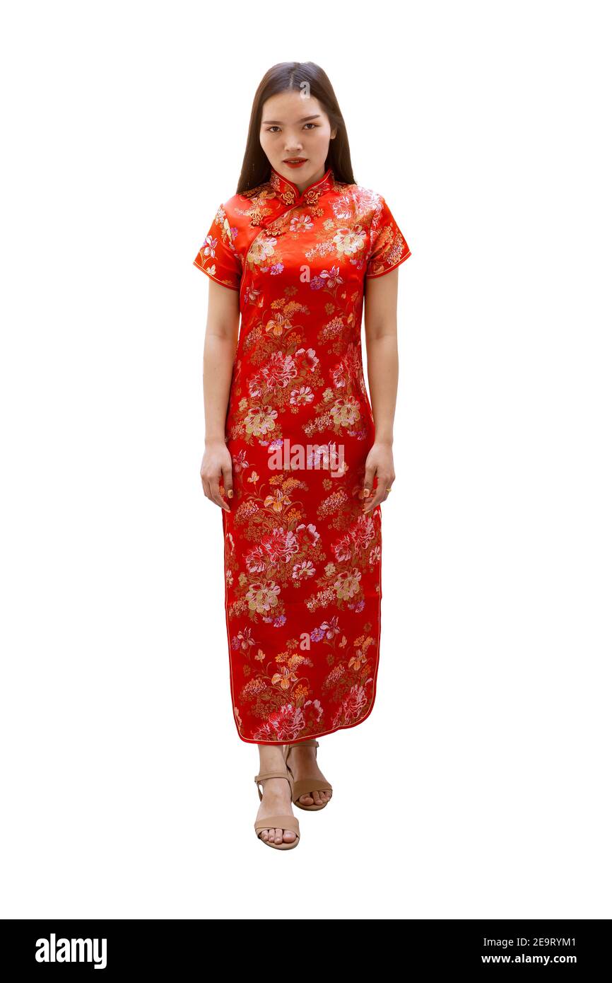 Chinese women dress with Cheongsam or Qipao traditional outfit for festive seasons Chinese New Year isolated on white background with clipping path. Stock Photo