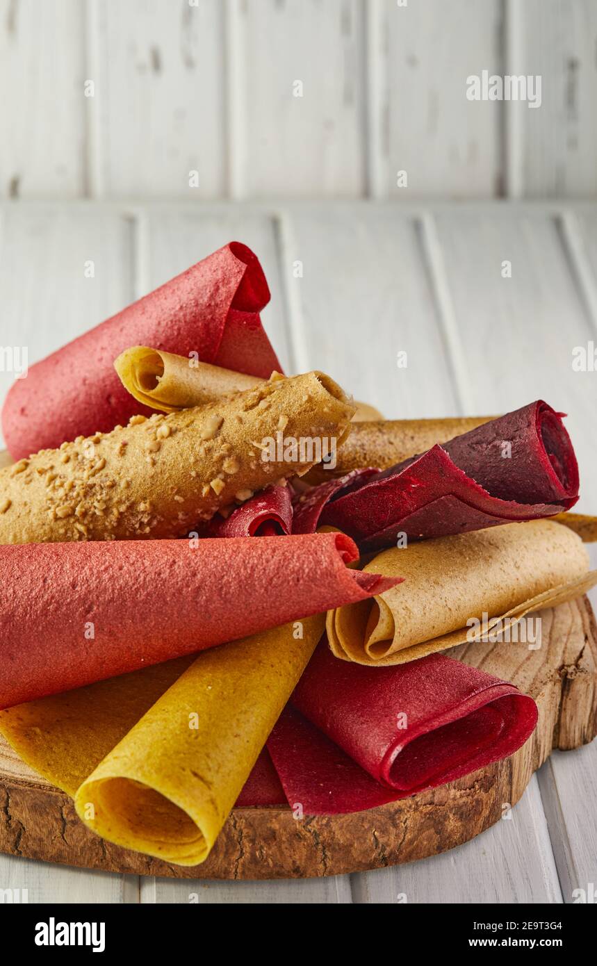 Sweet pure fruit pastille in rolls. Healthy sweets lozenges, fruit