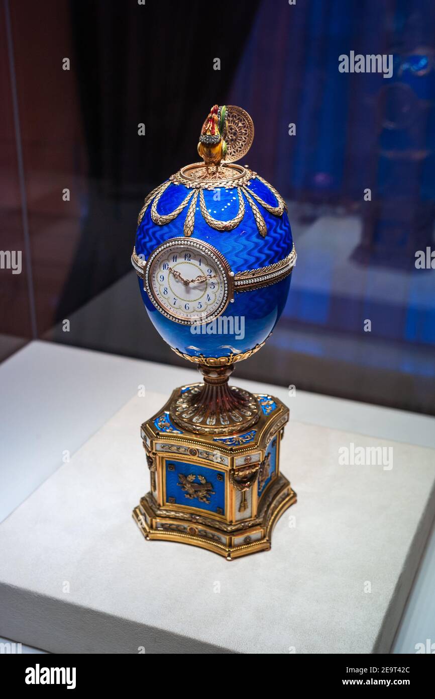 Saint Petersburg, Russia - ca. December 2017: Blue Faberge Easter Egg with a Clock Dial and a Cockerel called Kelch Chanticleer Egg at the Faberge Mus Stock Photo