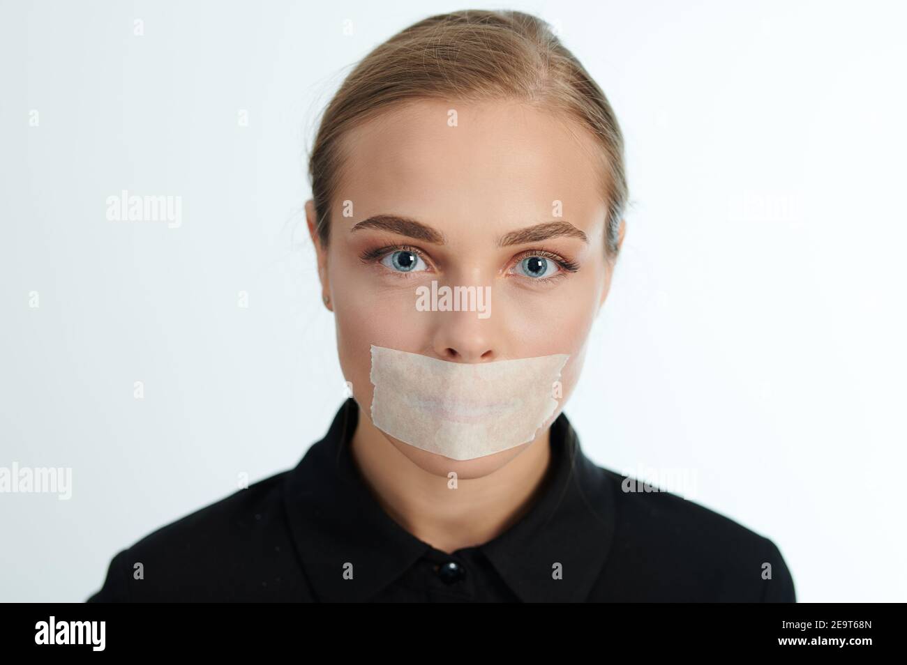 Headshot of woman with covered mouth. Censorship theme Stock Photo Alamy