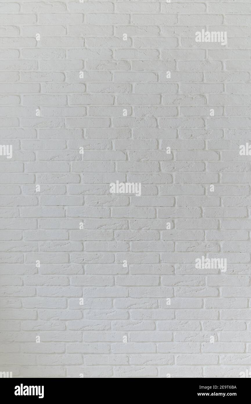 Grunge white brick backdrop. Surface of gray brick wall Stock Photo