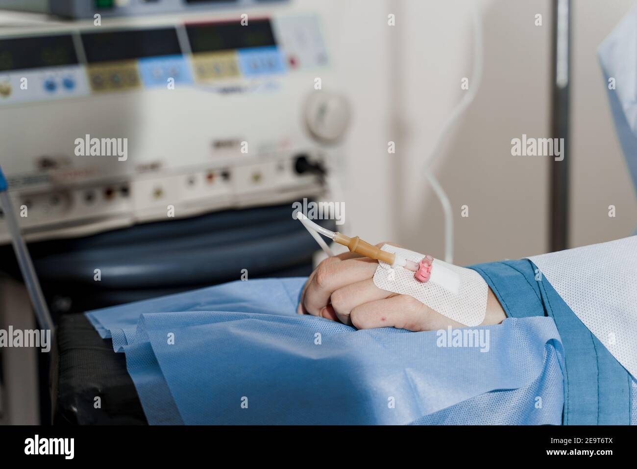 Catheter safely inserted into woman hand on plastic operation