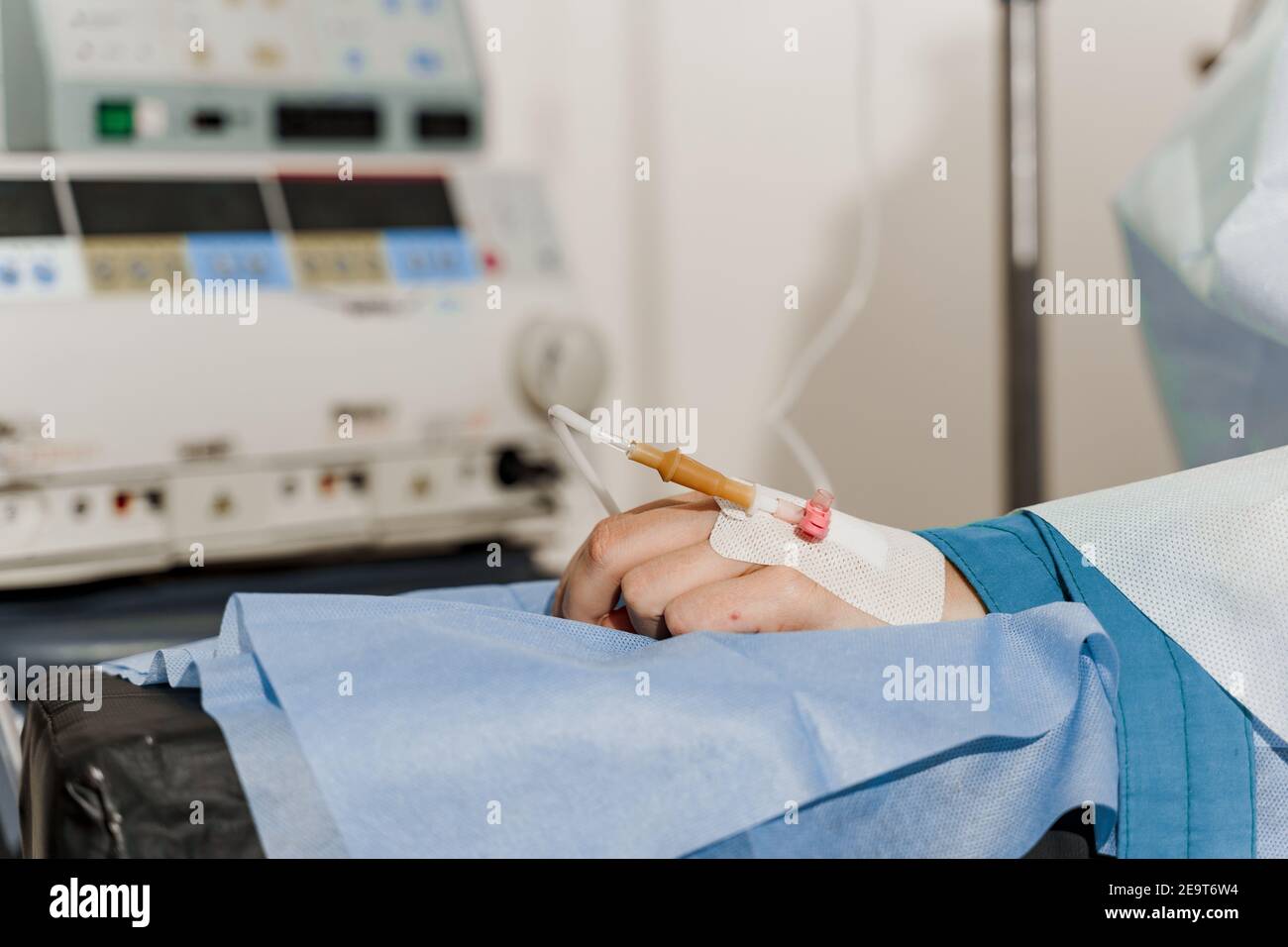 Catheter safely inserted into woman hand on plastic operation