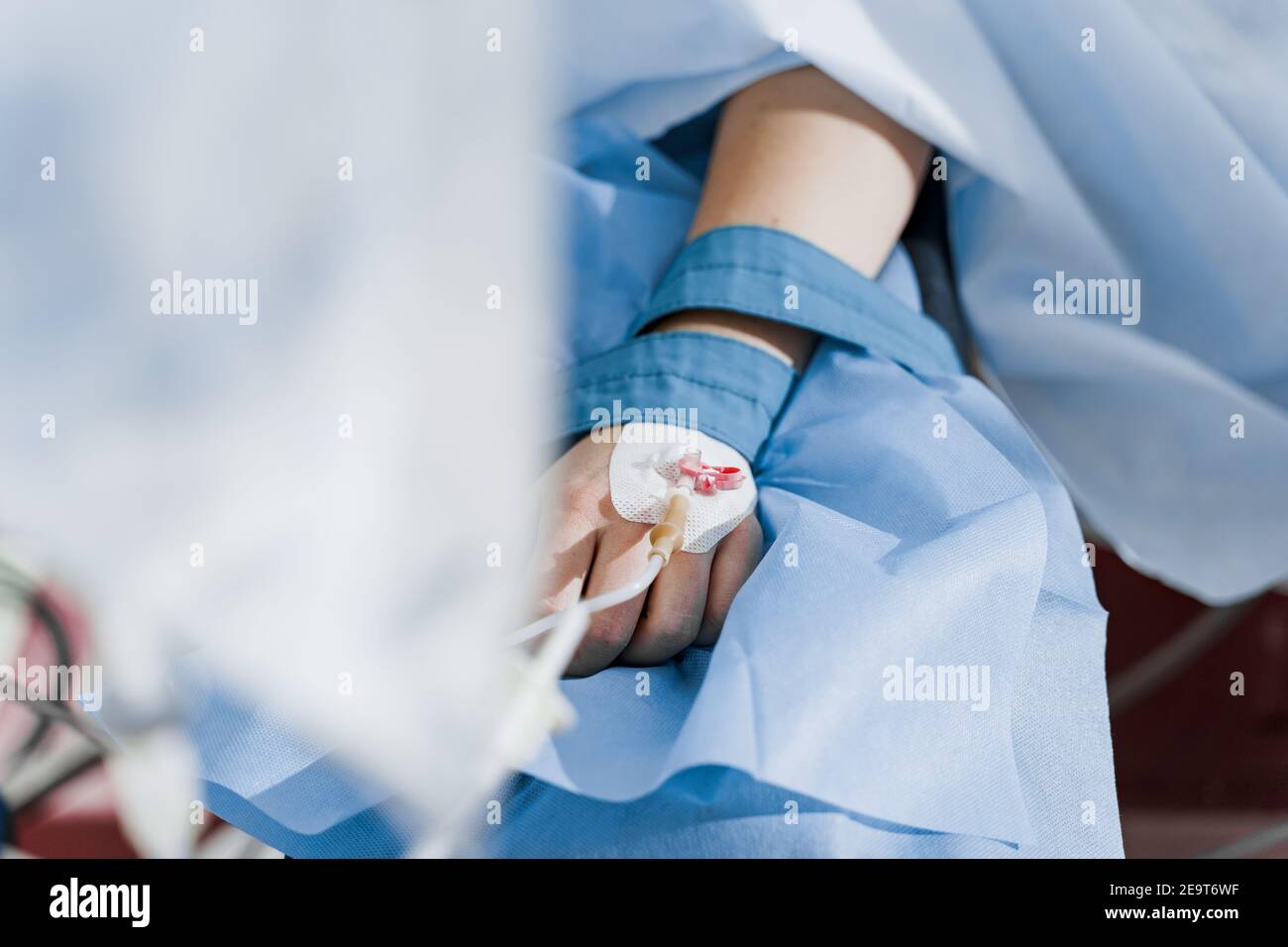 Catheter safely inserted into woman hand on plastic operation