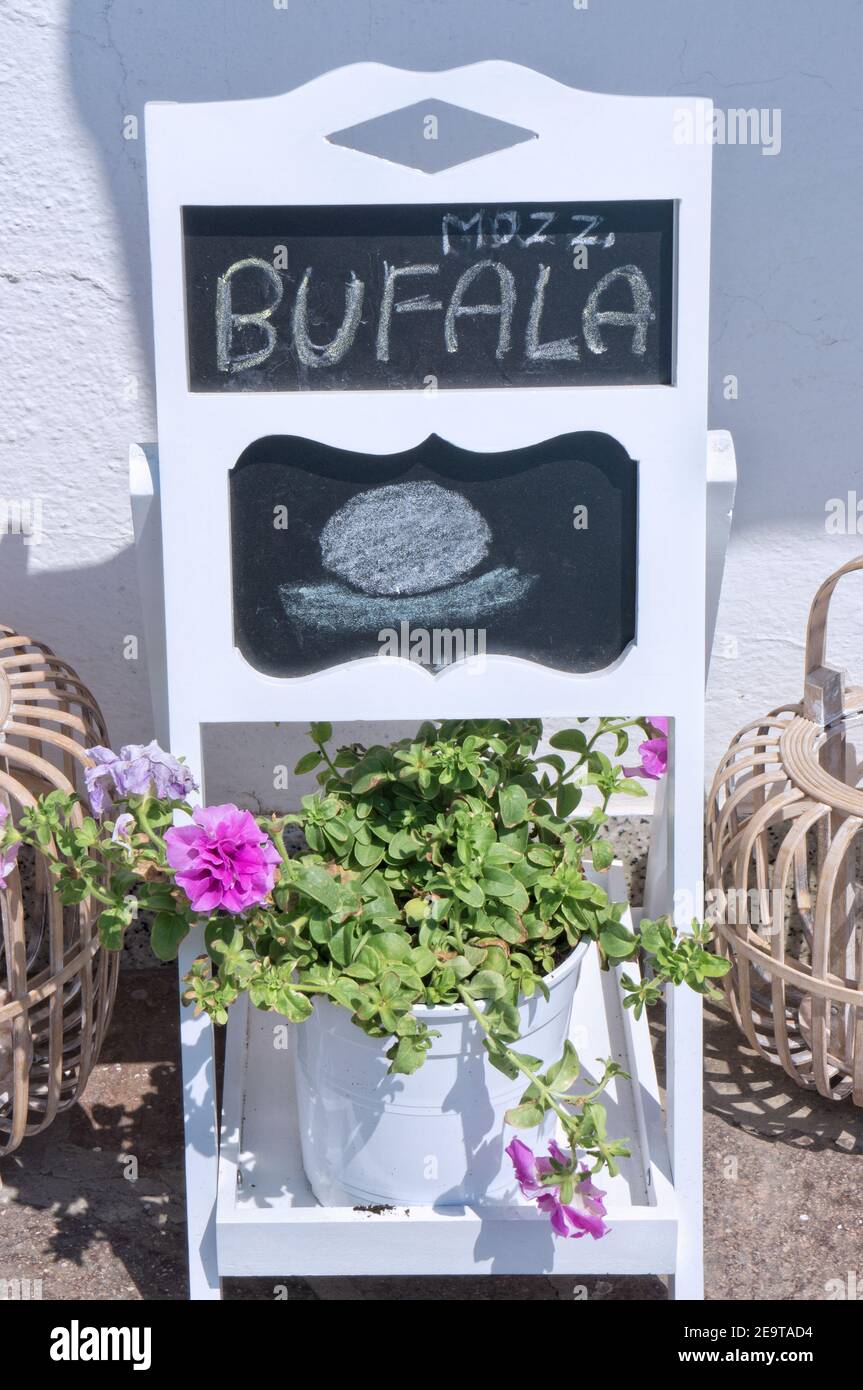 Buffalo mozzarella sign outside an italian grocery store Stock Photo