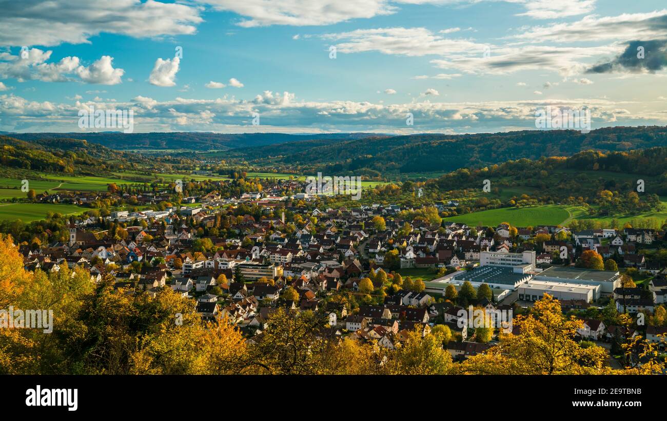 Germany, Aerial wide view above houses of city rudersberg in wieslauf valley surrounded by swabian forest nature landscape in autumn Stock Photo