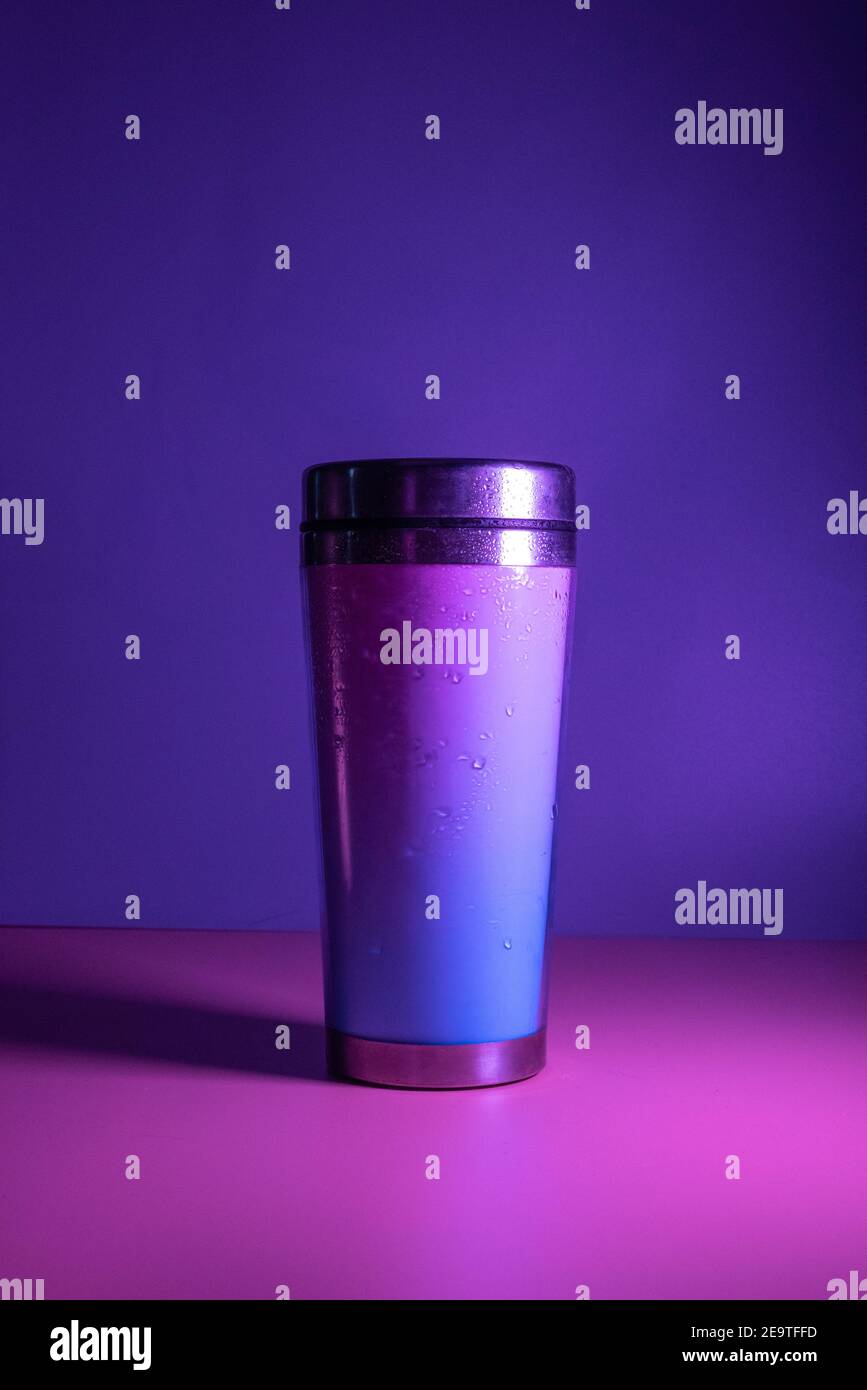 cocktail shaker in pink tones on purple background Stock Photo Alamy