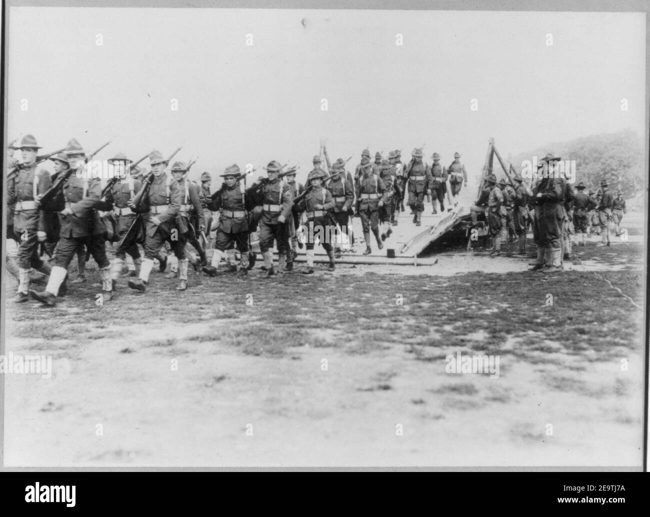 N.Y. National Guard training and maneuvers at Fishkill and Peekskill, N.Y.- Column of troops crossing dry bridge construction by engineers Stock Photo