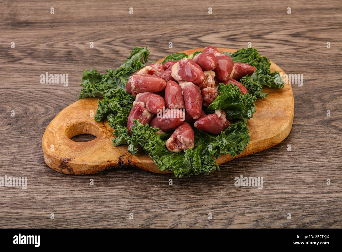 Raw chicken hearts heap for cooking Stock Photo Alamy