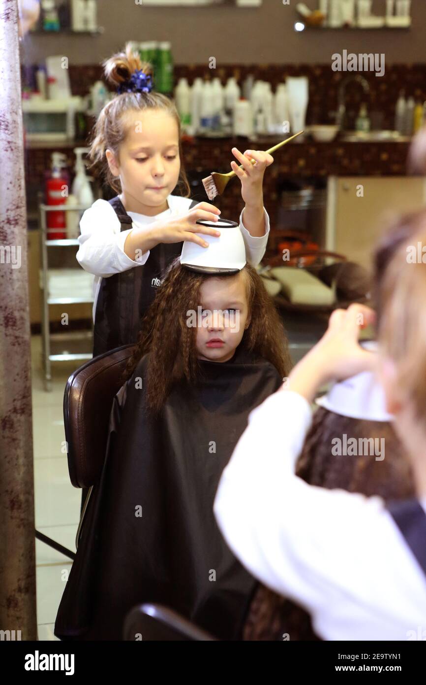 The girl dyes her hair. Stock Photo Alamy